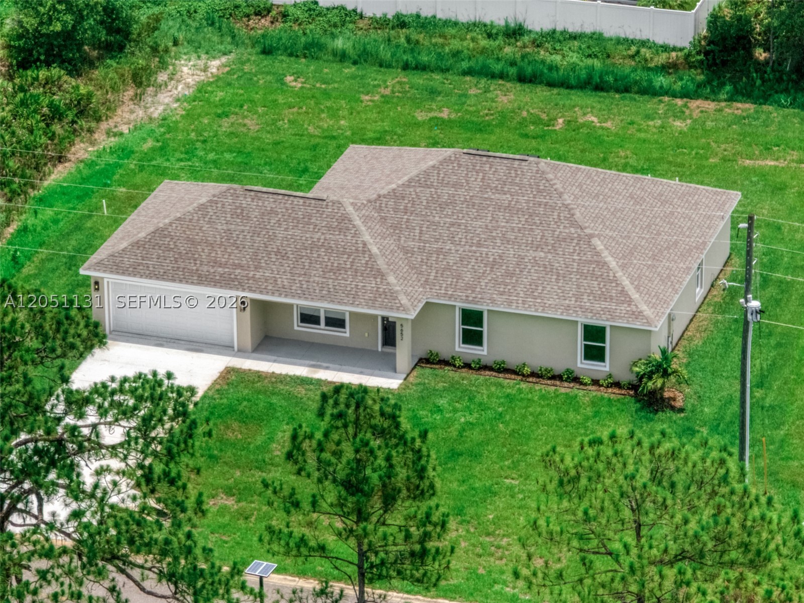 Welcome to this beautifully designed "Everglades Model", located in the highly desirable Sun N Lake Golf Community. This brand-new home features a light and bright open floor plan with over 1,800 square feet of living space, offering the perfect combination of comfort, style, and functionality. The split bedroom layout includes 4 spacious bedrooms, 2 full bathrooms, attached 2 car garage, and plenty of room for family and/or out of town guests. Interior perks include vinyl plank flooring, vaulted ceilings, elegant quartz countertops, modern LED lighting, Upgraded Harvest Wood soft close cabinets, and stainless steel kitchen appliances. Open-concept living and dining areas create welcoming spaces ideal for everyday living and entertaining. Peace of mind with central water irrigation and sewer systems for added value of underground utilities. Located in the vibrant Sun N Lake Country Club community, residence enjoy an active lifestyle with two championship 18-hole golf courses, a community pool (with a newly expanded pool coming soon), playgrounds, pickleball courts, basketball courts, frisbee golf, dog park, and numerous other recreational hiking trails. Conveniently located near medical facilities, shopping, dining, and all that Sebring has to offer, this home is an excellent opportunity to enjoy Florida living in one of the area's most sought after communities.*A well water irrigation system with 3 zone timer is included which you cannot find in other new construction.