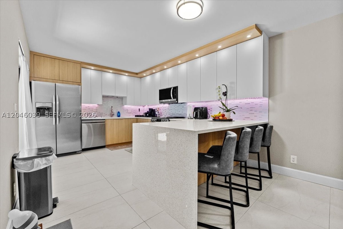 In the vibrant heart of the city, with immediate access to major highways, this remodeled home is a stylish retreat. With two bedrooms, two bathrooms, and a half-bath, a chef-worthy kitchen, and an enchanting patio with an outdoor gourmet kitchen. Plus, it’s steps away from banks, supermarkets, hospitals, offers easy access to any part of the city, and is in an excellent school district.