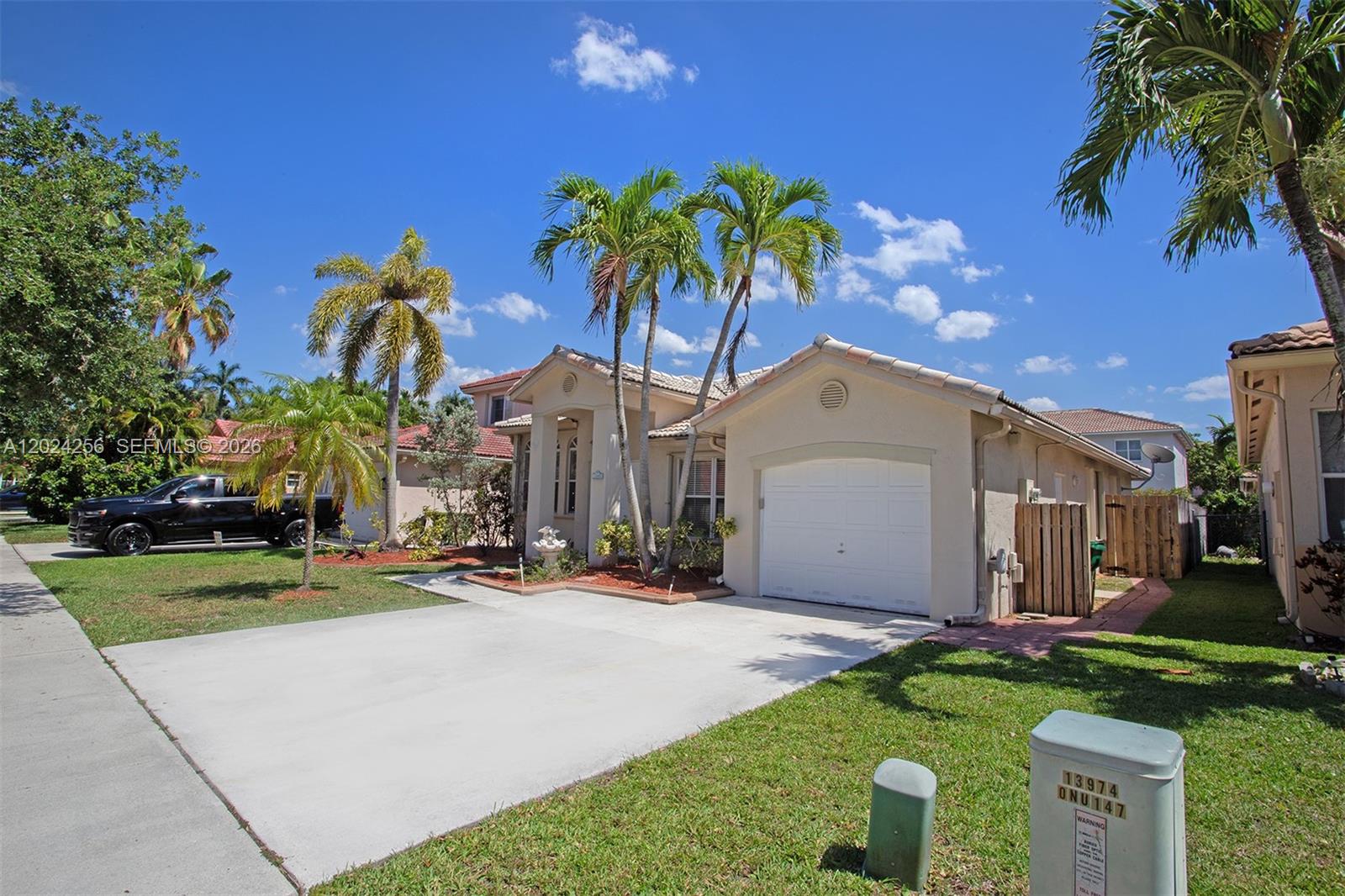 One story house located in a gated community. It features high ceilings and spacious rooms. Upgraded Kitchen with custom cabinets and stainless steel appliances. Tile and wood flooring throughout and natural light. The primary Bedroom offers closet space and well appointed bath. Covered screen patio and private backyard. Washer and dryer located in the garage and with a connecting door to the patio.