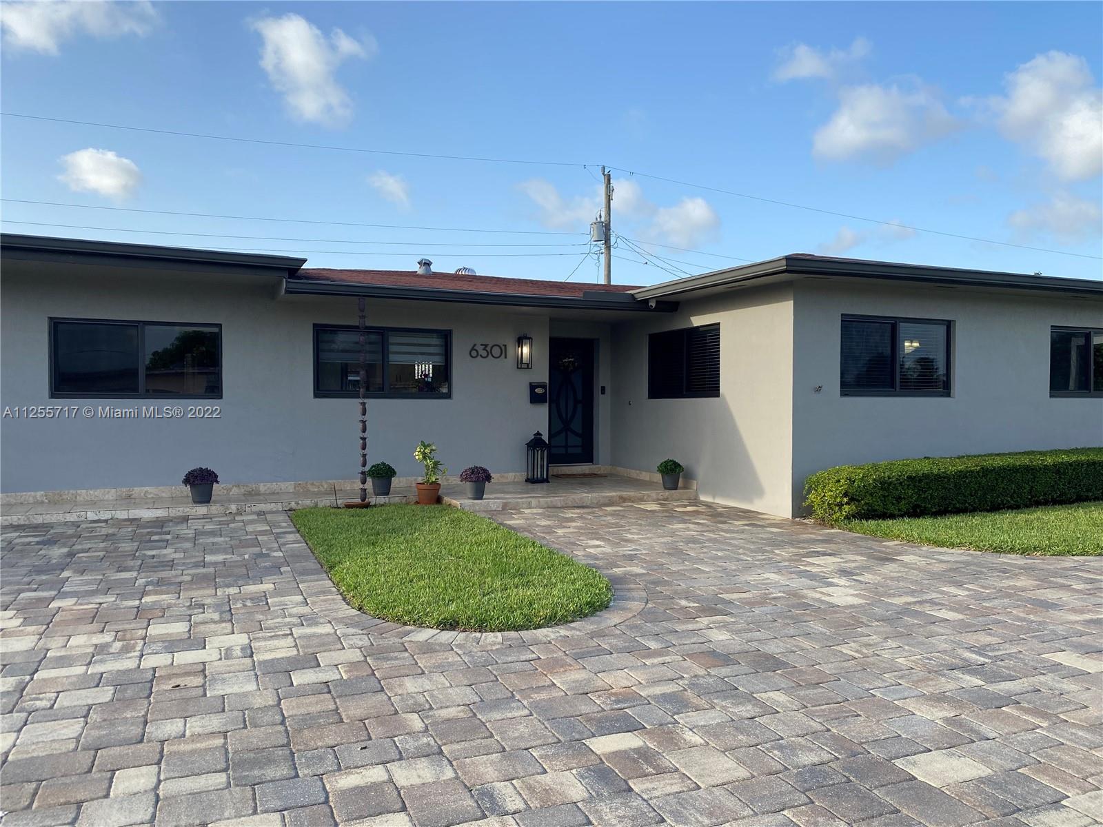 Beautifully maintained 3bd/2Bth Home with plenty of parking on the oversized  circular driveway. Home features an elegantly upgraded kitchen with stainless steel appliances, gas stove, double wall ovens, wine fridge, Hurricane impact windows, tankless water heater, generator and fenced yard with enough room for a pool, RV or boat. This cozy home is move in ready. Showing Sat 8/13 & Sun 8/14 from 12-3pm