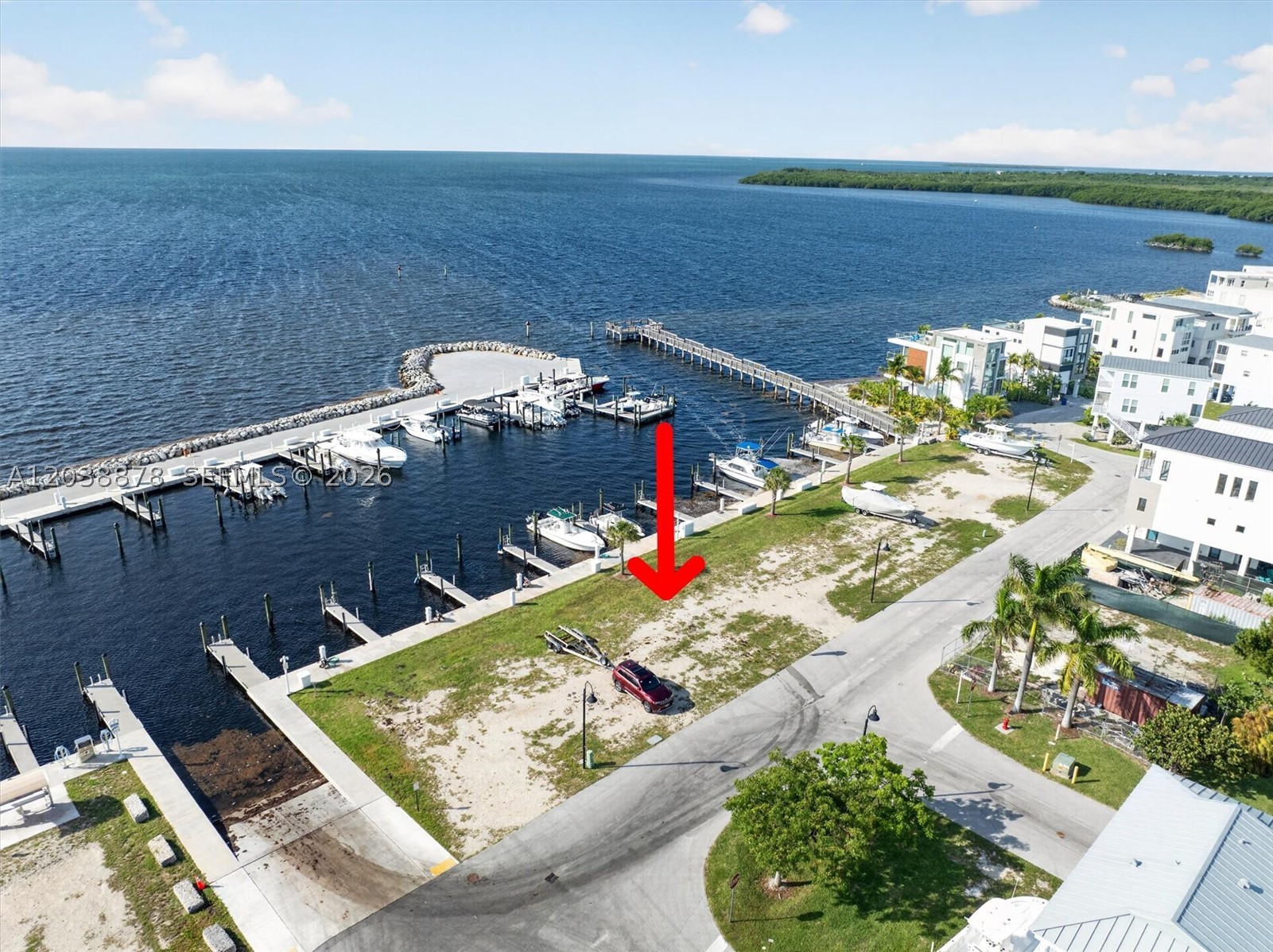 Build your dream home on this prime cleared oceanfront lot with open, no bridges access in the exclusive residential community of Key Largo Ocean Resort (KLOR), at MM 94.8. Spanning 22 acres, this 24 hr. guard-gated community reflects the uniqueness of coastal design homes and ocean living, framed by swaying palms and sea breezes. KLOR boasts an array of resort amenities including a full-service marina, boat ramp, clubhouse, swimming pool, fitness center, tennis, basketball and pickleball courts, children's playground, an iconic fishing pier, community events and so much more! Boat slips are not deeded. Property is ROGO exempt; easy to build. Seize the opportunity to build your own home in a highly desirable community in the Upper Keys, with friendly rental restrictions.