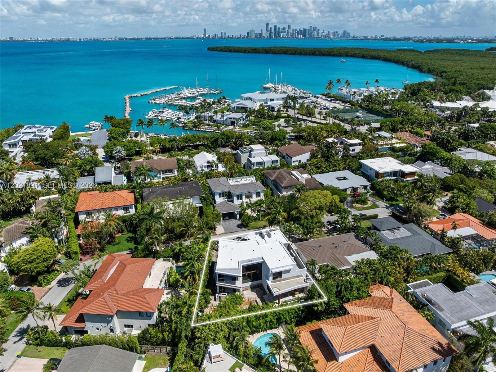 A unique architectural masterpiece in the heart of Key Biscayne, this brand-new contemporary residence by Praxis Architecture blends modern tropical luxury with exceptional craftsmanship and bespoke European finishes. Set on an oversized 9,000 SF lot, the residence offers 6 bedrooms, 6 full bathrooms, 1 half bath, and over 4,190 SF of curated living space designed around natural light, privacy, and seamless indoor-outdoor living.
Imported Spanish porcelain and ceramic surfaces, Italian-engineered wood flooring, Portuguese interior doors, and refined finishes sourced from the United Kingdom create a warm and sophisticated architectural atmosphere throughout. Custom millwork — including the kitchen, bar, wardrobes, and integrated TV units — was exclusively crafted by a French maison specializing in ultra-luxury bespoke cabinetry.
The residence highly designed kitchen is equipped with Wolf, Sub-Zero, and Miele appliances, smart-home automation, and integrated security. Outdoor spaces feature a spectacular 36-foot swimming pool, expansive terraces, summer kitchen, lush private garden patio, and multiple entertaining areas designed for effortless resort-style living.
Located moments from tennis courts and the Key Biscayne Yacht Club, beaches, marinas, top-rated schools, and the best of island living, this residence represents one of Key Biscayne’s most thoughtfully designed brand new-construction homes - Expected to be finished in July 2026. Easy to Show!
