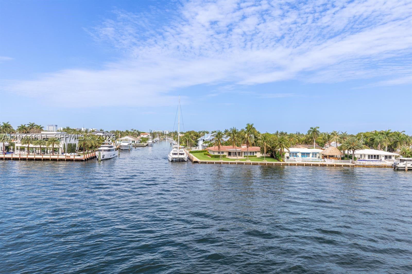 Priced below market sale comps.  Furnished and turnkey waterfront living on the Intracoastal. This large one-bedroom is wrapped in expansive hurricane-impact windows that frame open water views and fill the living and dining areas with natural light. The layout is spacious and functional — an easy flow for daily living and entertaining alike. Well maintained throughout, with a newer A/C system and water heater, both under five years old. The building's 50-year certification is complete and paid, all assessments are paid current, and the seller is covering the new roof assessment. Walk to the pier, shops, and dining, with beaches close by. Move in with nothing to buy and nothing to fix — a rare chance to own on the water at this price point.