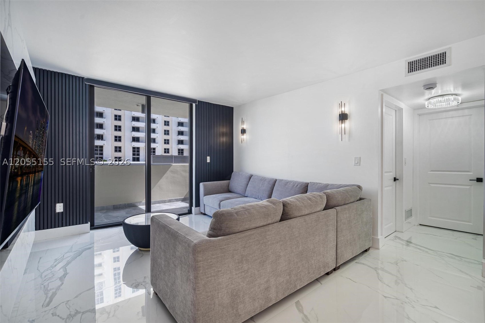 Masterfully reimagined, this stunning 2-bedroom, 2-bathroom Miami Beach residence has been completely renovated with impeccable craftsmanship, timeless design, and modern luxury. The light-filled interior features seamless porcelain tile flooring throughout, while the designer kitchen showcases custom cabinetry, premium appliances, and refined finishes. Every detail has been thoughtfully updated, including new drywall, beautifully renovated bathrooms, and a brand-new washer and dryer, creating a truly move-in-ready home. Ideally located in the heart of Miami Beach, you're just minutes from pristine beaches, world-class dining, luxury shopping, marinas, and vibrant nightlife. Whether you're seeking a primary residence, vacation getaway, or investment opportunity, this exceptional home offers the perfect blend of style, quality, and an unbeatable location.