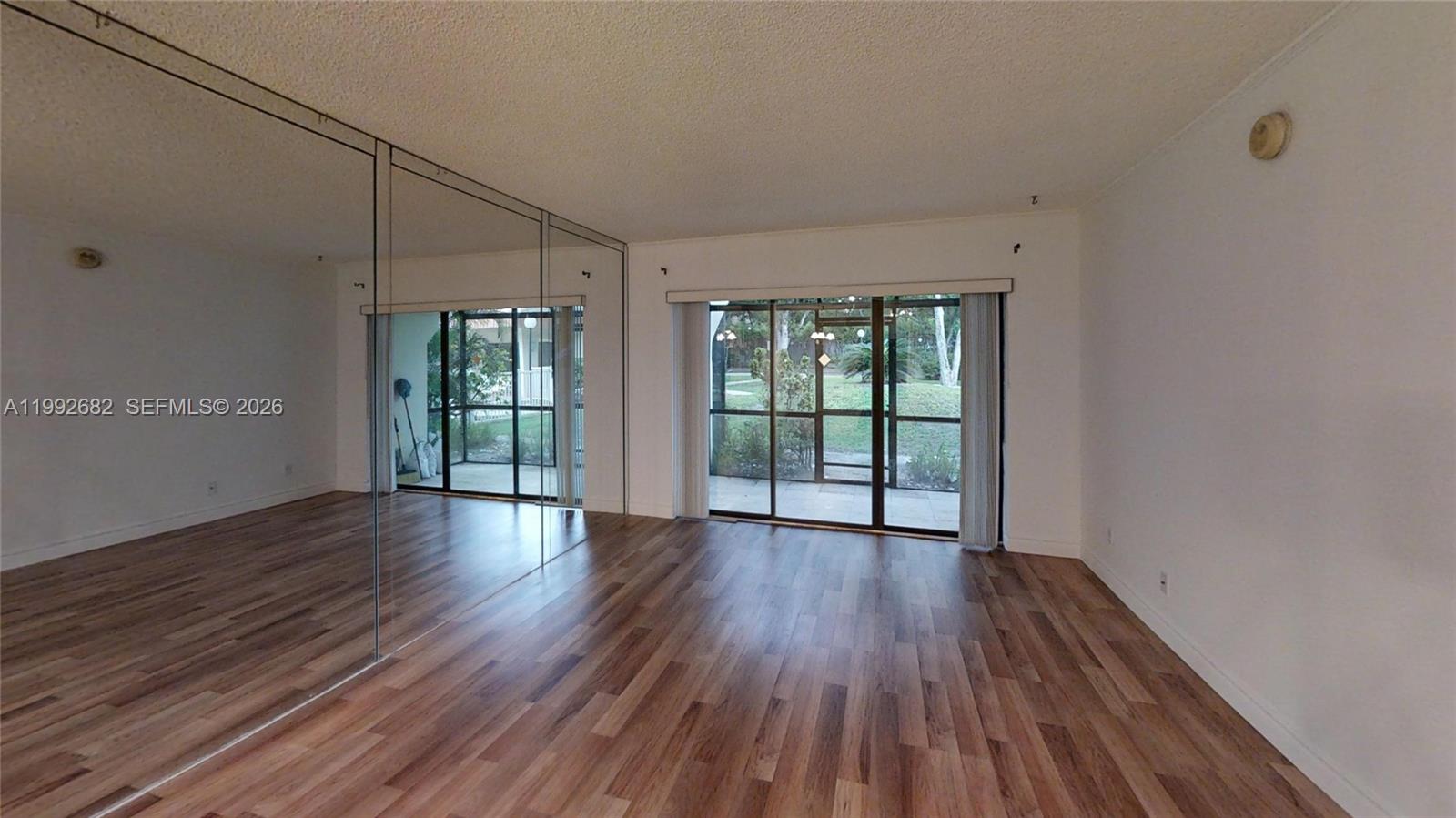Be a part of this peaceful, small community of Raintree. This is a 2 bedroom and 1.5 bath. The patio has been completely renovated with new travertine tiles, new screen mesh, and thick glass windows at the bottom frames to prevent critters from trespassing. Every room and ceilings have been freshly painted and new waterproof vinyl flooring installed. Enjoy the ease of modern, stainless steel appliances including high-end dependable LG washer/dryer, iSamsung French refrigerator and Sharp microwave oven for your convenience. Kitchen boasts lots of cabinets with new sink and has a window view that showcases the beautiful, well-maintained community pool. Both bathrooms have new mirrors and guest bath has new toilet bowl with a high-tech flushing system.No leasing first year. 2 People allowed to live in unit. Raintree has reserves and the possibility to purchase with 5% down. Pets Ok. New Roof and no assesments. New ac and water heater 2023