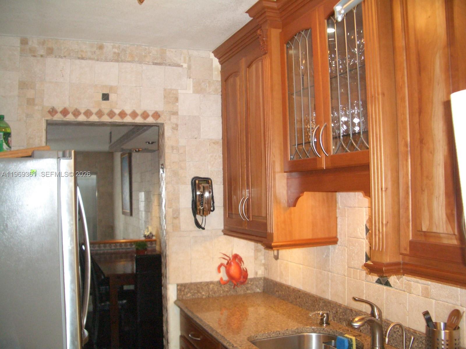 Spacious 2/1.5, two story unit with wood flooring throughout, remodeled kitchen with wood cabinetry,  marble countertops and stainless steel appliances. Centrally located in desirable Kendall community.  Close to shopping, dining and easy access to all major expressways, can walk to Miami Dade College.  Community pool and assigned parking.  Bedrooms are on second floor, washer and dryer inside the unit.