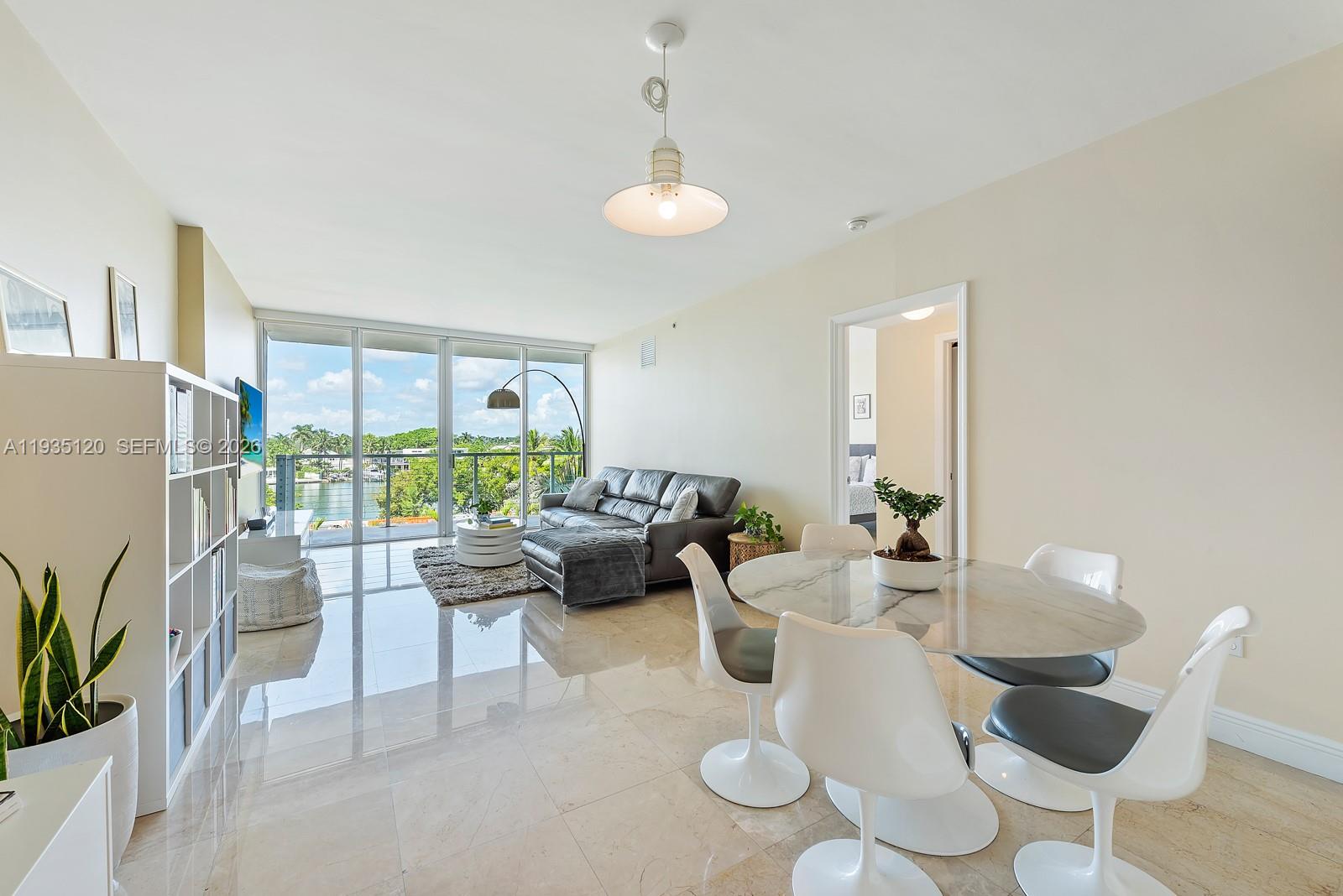 Welcome to NoBe #4D: Bright Beachside Living. A stunning 2 Bed/2 Bath waterfront condo, offering the perfect blend of contemporary design and comfort. Complete with marble floors and modern stainless steel kitchen with granite countertops, all meticulously maintained for your arrival. The spacious balcony provides captivating Creek views, enhancing your living experience. This boutique residence not only boasts a rooftop pool with panoramic vistas, but also offers the flexibility of renting it four times a year, making it an ideal investment or your dream home. Situated in vibrant North Beach, you're steps away from exquisite dining, shopping, and the beach, with easy access to Bal Harbour and South Beach. NoBe #4D: Where luxury meets location in your waterfront retreat.