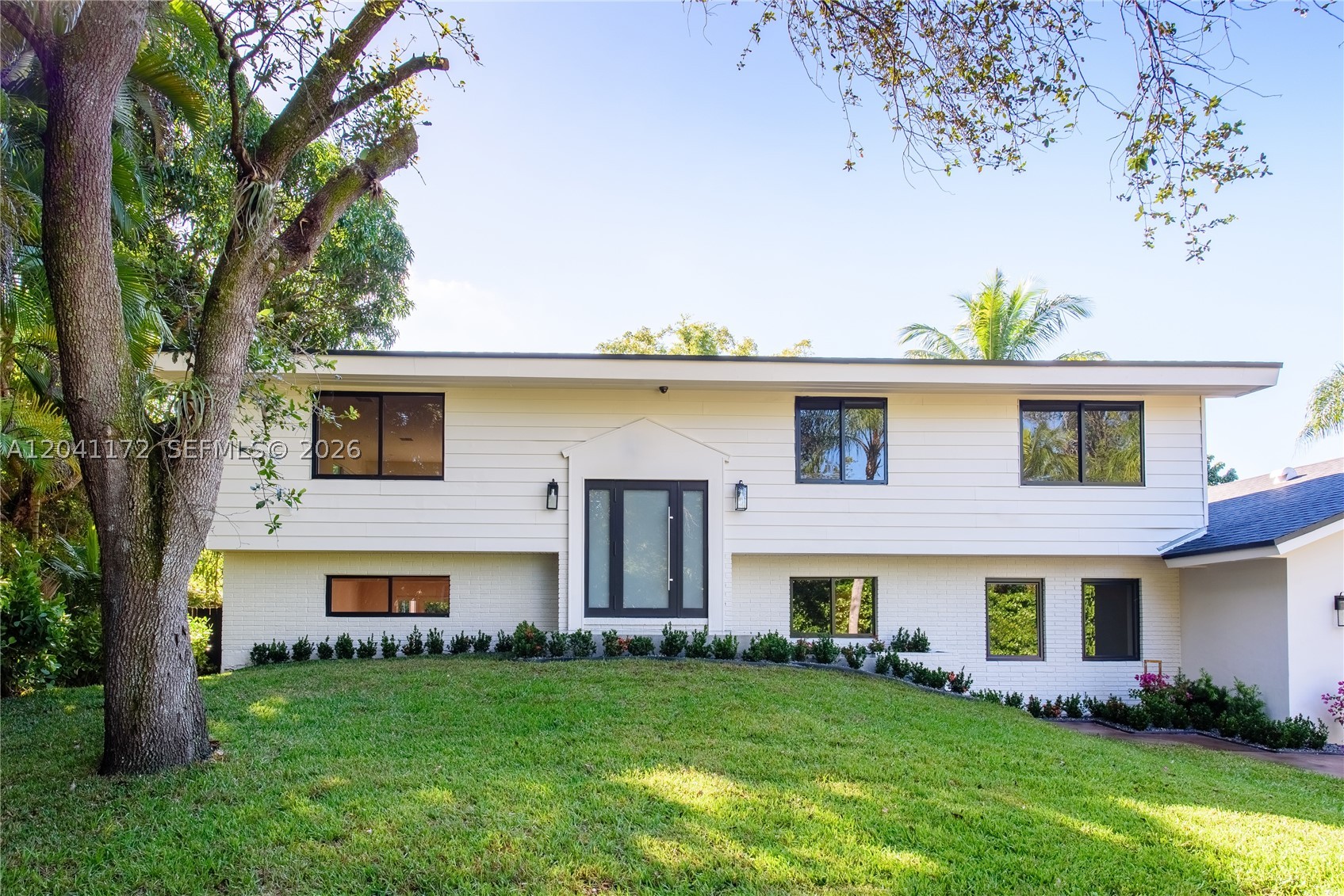 Fully re-designed transitional home in a highly desirable Miami location, with in-laws quarters. This home has been rebuilt with new electrical, plumbing, roof and interiors. The re-imagined floor plan flows naturally and maximizes functionality with an isolated master suite for privacy. Elegant finishes, modern design elements, and thoughtful spatial planning create a seamless blend of comfort and sophistication. Move-in ready on a beautiful street, in an established neighborhood. A must-see for buyers seeking a turnkey, design-forward property.