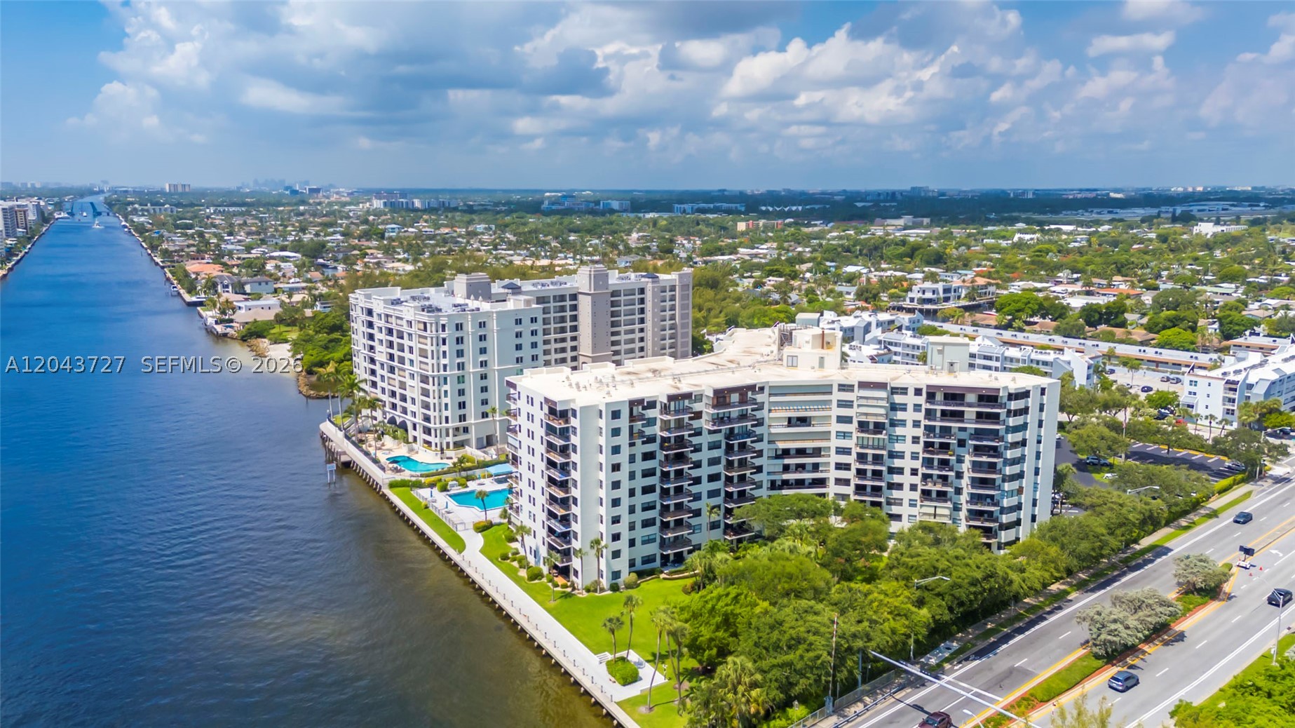 Rare opportunity to own one of the building's most desirable southeast corner residences with breathtaking panoramic Intracoastal and Atlantic Ocean views. Watch boats cruise by and enjoy spectacular sunrises from your private balcony from nearly every room—living here feels like you're on vacation every day! This spacious 2-bedroom, 2-bath residence features an open-concept layout with an updated eat-in kitchen, separate dining area, bamboo flooring in the bedrooms, remote-controlled blinds, a large walk-in closet, and an in-unit washer and dryer. Freshly painted and features a new A/C and water heater, this home is truly move-in ready. The building has also successfully completed its 40-year certification, providing added peace of mind. Two garage parking spaces are included. Resort-style amenities include a heated waterfront pool, fitness center, sauna, 24-hour security, fiber optic internet, and a pet-friendly community. Ideally located on the west side of the Intracoastal with no bridge delays, just minutes from the beach, waterfront dining, shopping, golf, and the public boat ramp.