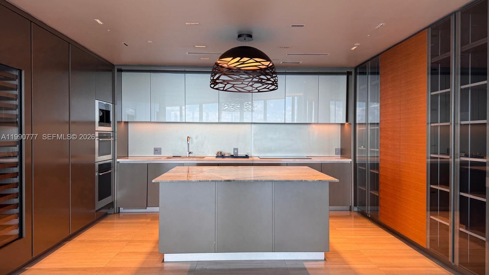 Discover a masterpiece at 18975 Collins Ave, Unit 2500—a corner residence with four bedrooms and five-and-a-half baths. Offering 3,748 sq. ft. of refined interiors plus 1,400 sq. ft. of terraces, this home spans 5,148 sq. ft. in total. Floor-to-ceiling glass frames sweeping Atlantic views, while interiors feature marble and premium tile finishes, an Italian-inspired kitchen with integrated luxury appliances, and a private two-car garage. Ownership includes the coveted Armani/Casa lifestyle: ocean-view fitness studio, Turkish Hammam spa, resort pool deck with attentive service, and private water access. Ideally positioned between Bal Harbour’s designer boutiques and Aventura’s dining scene, Unit 2500 defines Miami waterfront living.