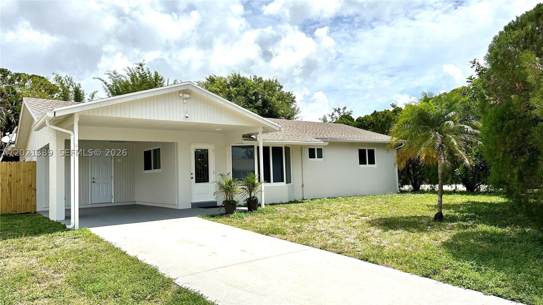Beautifully remodeled 3-bedroom, 2-bathroom one-story home nestled in a charming and quiet neighborhood in West Boynton Beach. This move-in-ready property offers tile flooring throughout and 1,307 square feet of comfortable living space situated on an oversized 7,906 sq. ft. lot with plenty of room for outdoor entertaining, gardening, or future additions and equipped with a sceptic tank. The home has impact windows, providing both peace of mind and energy efficiency. The updated modern kitchen showcases elegant quartz countertops, stainless steel appliances, and ample cabinet space.  Enjoy the large fenced backyard, offering endless possibilities for relaxation and recreation. Additional highlights include a 1-car carport and an extended driveway with plenty of extra parking.  Conveniently located near major highways, shopping centers, restaurants, parks, and schools. A wonderful opportunity to own a nicely updated home in a desirable pet friendly location with no HOA. AC 2022; water heater 2023; roof 2005; Washer/dryer approximately 5 years; refrigerator, dishwasher, oven, microwave 4 years.