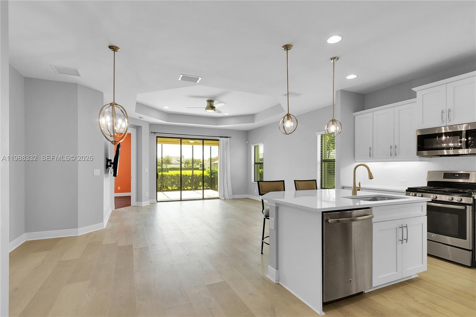 Beautifully upgraded villa with water Lake view on a premium corner lot just steps from the clubhouse in the highly sought-after Watermark community built by Neal Communities. This 2 Bedroom plus Den (easily converted into a 3rd bedroom), 2-bath home offers a bright open layout with LUXURY VINYL FLOORING throughout the main living areas, designer lighting, and a modern kitchen featuring GRANITE COUNTERTOPS, GAS COOKING, island, pantry, and NEW UNDER-CABINET LIGHTING, along with updated lighting over the dining area and island.

The primary suite includes CUSTOM CLOSETS and an upgraded bath with NEW VANITY, NEW LIGHTING, FRAMED MIRRORS, and a COMFORT-HEIGHT TOILET. The guest bath has also been tastefully updated with new lighting and mirrors. Additional improvements include added shelving in the spare bedroom closet, pantry, and laundry room, a NEW EPOXY-COATED LANAI FLOOR, and FULL HURRICANE PROTECTION with ACCORDION SHUTTERS plus clear shutters for the front windows. The home also features a NEW FURNACE AND A/C SYSTEM for peace of mind.

Enjoy one of the longest driveways in the neighborhood with extra parking and a peaceful water view. The resort-style clubhouse offers a pool, spa, fitness center, pickleball, tennis, and more.

Centrally located in Fort Myers inside of a NO FLOOD ZONE with quick access to shopping, dining, and everyday conveniences. Low HOA includes lawn care, irrigation, internet, exterior pest control, and amenities.
