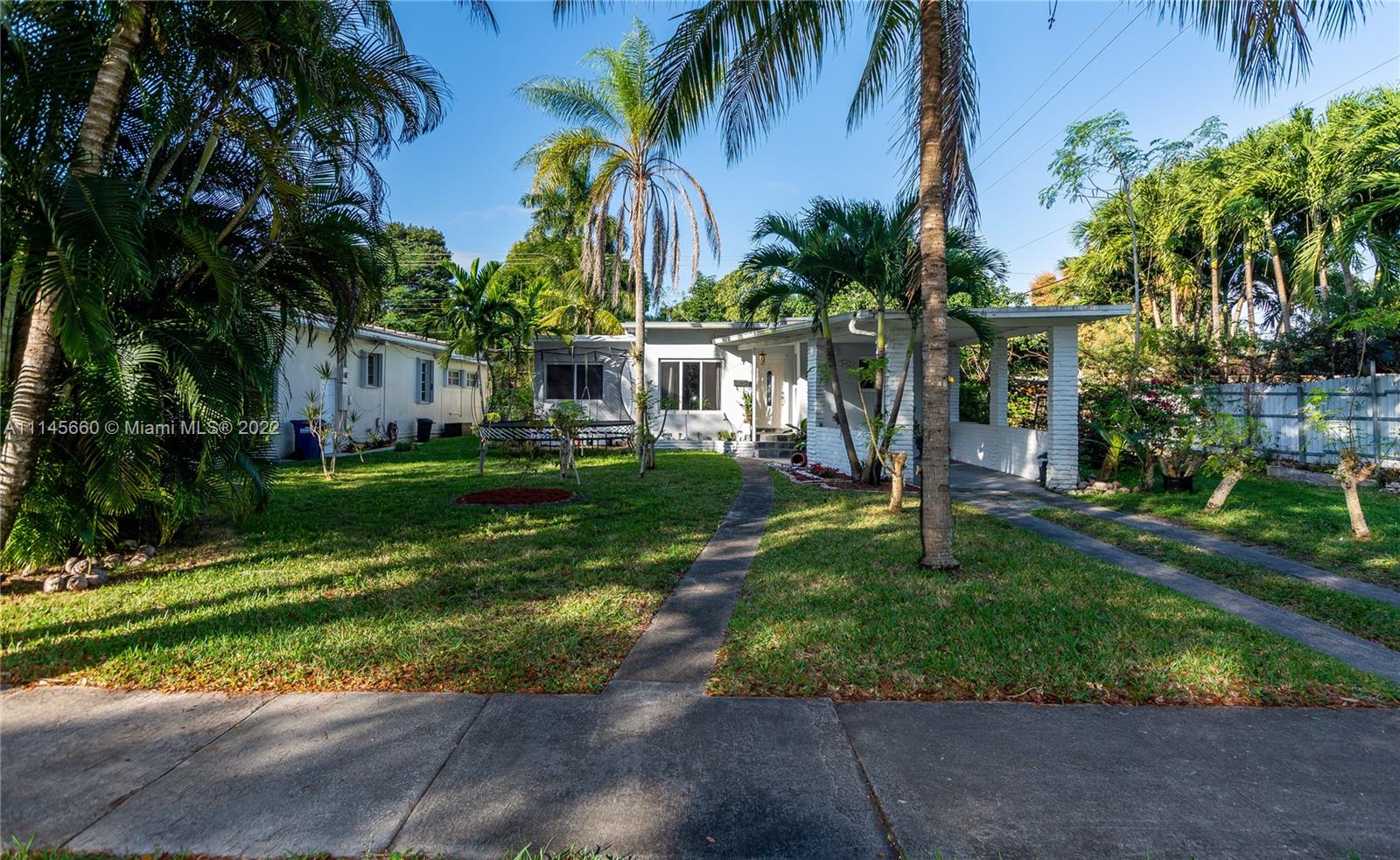 This cozy updated 2-bedroom, 1 bathroom home is perfect for a young family or someone looking to downsize. The home features 1,296 sq ft of living space, impact windows, indoor laundry facilities, carport and a tropical garden with fruit trees. This special home also features hardwood floors, fireplace, well sized and updated kitchen, spacious family room and a large screened in backyard patio. Enjoy your morning coffee outside in your screened patio and listen to the sounds of nature in the morning. This beautiful move in ready starter home will not last long.