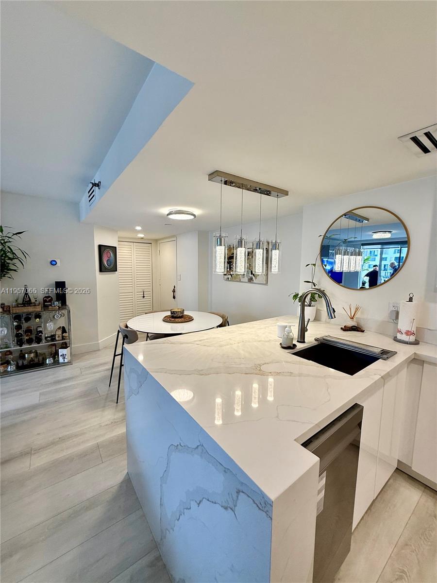 Stunning 2BD/2BA Condo with Breathtaking Bay & City Views on Brickell Key! Fully renovated and furnished with impact windows and doors, new baths, sleek European-style kitchen, stainless steel appliances, tile plank floors, tons of natural light and amazing city and bay views. Features a split floor plan, 1 assigned parking space with availability for another, and new A/C. Enjoy resort-style living with 24hr concierge, valet, tennis courts, heated pool & spa, waterfront gym, club room, business center & more. Prime location—walk to Brickell City Centre, top restaurants, and parks. Just minutes to highways, Downtown, and Miami Beach!