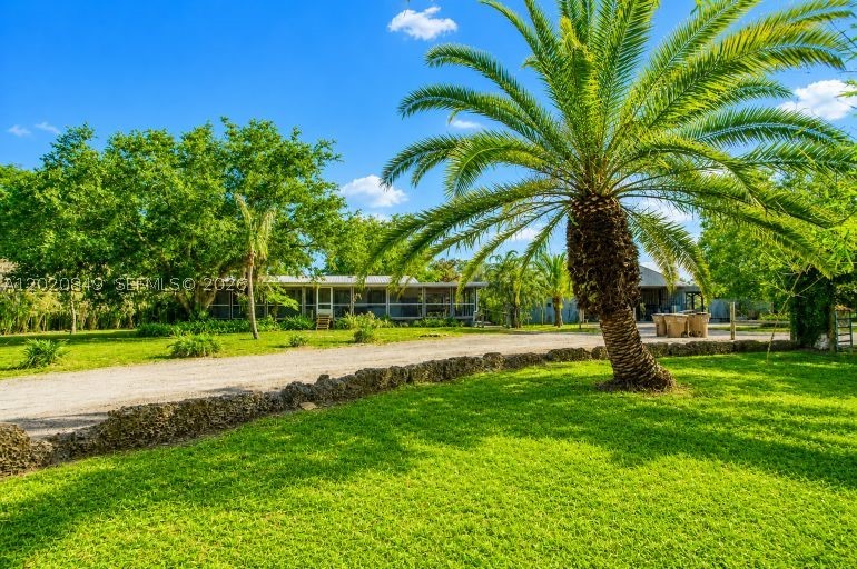 Discover the rare opportunity to own 10 beautiful acres in the covered Alva area of East Lee County, where Old Florida charm meets endless potential. Tucked away at the end of Packinghouse Road, this private and secluded property offers a breathtaking park-like setting adorned with majestic live oak trees, lush tropical vegetation, and a peaceful pond that enhances the natural beauty of the land. 

The property is fully fenced and improved with a pole barn featuring an efficiency apartment, offering immediate usability and excellent potential to convert into a stylish barndominium, guest quarters, or workshop/living space. Also located on the property is an older double-wide mobile home, ideal as temporary residence while you build your dream estate, family compound, or country retreat. 

Perfectly positioned just off Florida State Road 80 and near Alva Diner, this location combines the tranquility of country living with convenient access to shopping, dining, and Southwest Florida amenities. 

Highly desirable Alva is known for its spacious estates, scenic beauty, and relaxed rural lifestyle-making this property a true gem for those seeking room to room, privacy, and unlimited possibilities. 

Bring your horses, toys, and vision-this is the Alva acreage you've been waiting for.