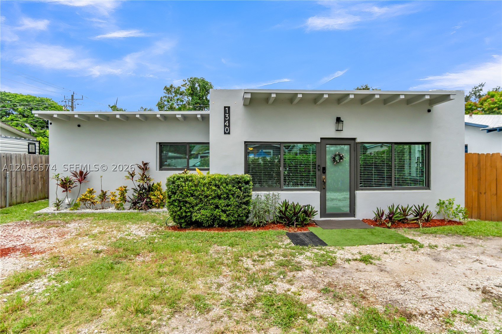 BEAUTIFULLY UPDATED AND TRULY MOVE-IN READY! THIS EXCEPTIONAL HOME OFFERS THE PERFECT BLEND OF STYLE, COMFORT, TRANQUILITY AND FUNCTIONALITY. RECENT UPGRADES INCLUDE: IMPACT WINDOWS AND DOORS, AN UPGRADED ELECTRICAL PANEL, ALL TILE FLOORING, NEW BASEBOARDS, FRESH INTERIOR PAINT AND A REMODELED KITCHEN AND BATHROOM WITH QUALITY FINISHES. ADDITIONAL IMPROVEMENTS INCLUDE NEW REFRIGERATOR AND DISHWAHER, ROOF GUTTERS AND A BACKYARD DRAINAGE SYSTEM FOR ENHANCED CONVENIENCE AND LONG-TERM VALUE. THE OVERSIZE BACKYARD PROVIDE ENDLESS POSSIBILITIES FOR ENTERTAINING, RELAXING OR ADDING A POOL. ALSO HAS A HUGE WORKSHOP SHED WITH A /C UNIT. CONVENIENT LAUNDRY ROOM. TERMITE TREATMENT WARANTY IS ALREADY IN PLACE AND IT'S TRANSFERABLE. PERFECT AS A PRIMARY RESIDENCE, VACATION GETAWAY OR INVESTMENT PROPERTY. IDEALLY LOCATED IN A HIGHLY DESIRABLE NEIGHBORHOOD, JUST MINUTES FROM THE BEACH, SHOPPING, DINING, LAS OLAS BOULEVARD, FORT LAUDERDALE AIRPORT AND MORE. A MUST SEE!