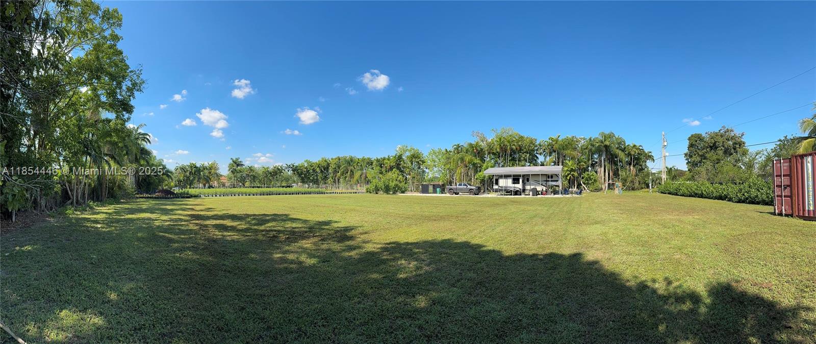 Property includes water, septic, electric service, and two wells. Features a 50 amp RV hookup, 40 ft shipping container, and a 35 ft metal roof structure on gravel foundation. Entire lot is secured with fencing and surrounded by lush, mature trees, adding privacy and natural beauty.

Zoned Agricultural and Residential, offering multiple use options for a custom home, agricultural development, or both. Currently leased to an operating nursery, providing immediate rental income. An agricultural exemption is in place, significantly lowering property taxes. No HOA. Cleared and ready for use. 

Excellent opportunity for investors, nurseries, or those seeking rural living with infrastructure already in place.