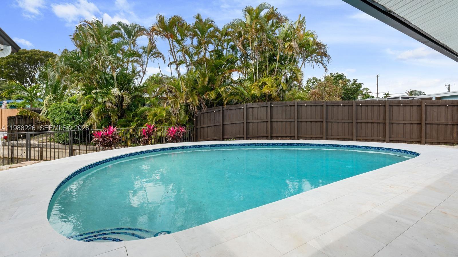 beautiful pool home with no hoa in the popular royal palm acres area.this 4-bedroom,2-bathroom home is on a quiet dead end street,giving you more privacy.the backyard is a dream,with a fully updated pool that has led lights and nice ambiant lighting, perfect for relaxing or hang out with family and friends.inside you will find a updated kitchen with new modern appliances and updated bathrooms.other upgrades include a new fence,nest thermostat,a electric water heater.the home also back up to a canal adding extra privacy and a peaceful vibe.great location near royal palm park and easterlin park, with easy access to highways and just minutes from fort lauderdale beach.move in ready and also a great opportunity for short term rental investment,schedule your showing before it's gone!