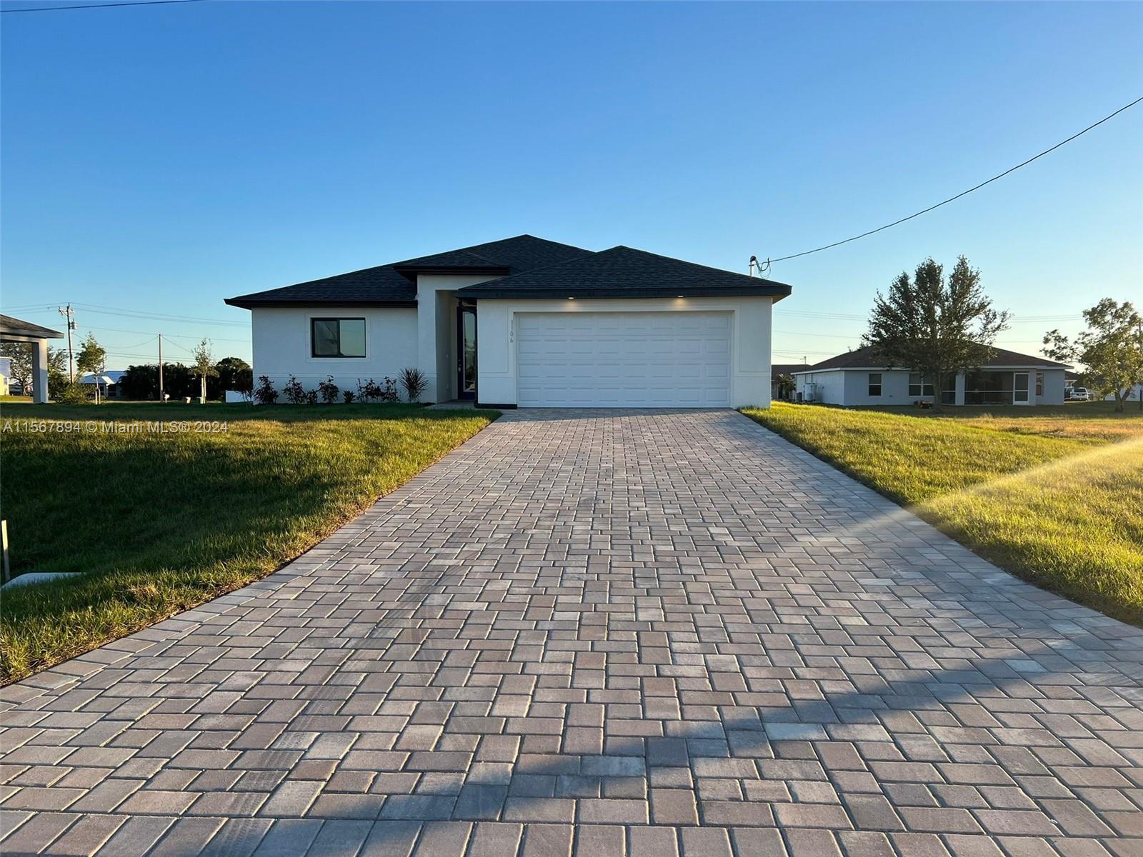 Welcome to your modern oasis in the heart of Cape Coral, Fl. This brand-new construction home is a blend of luxury, functionality, and coastal charm. Situated in a desirable neighborhood, this home offers proximity to popular amenities, schools, and parks, it promises a lifestyle of comfort and elegance. Featuring 4 beds, 2 baths, and a spacious 2 car garage, this home offers ample space for family living. The open floor plan connects the living areas, creating an inviting atmosphere. This home includes upgraded wood plank tiles, 6 car paver drive way, large kitchen with granite countertops, all appliances stainless steel. This modern single family home is located just 5 miles away from pine island RD where major shopping centers, retail, restaurants. Call now and don't miss out!!