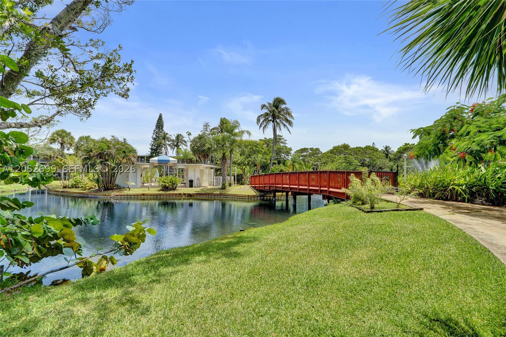 Great opportunity in East Deerfield Beach! This first-floor, lake-view condo features an assigned covered parking space right outside your door and super low maintenance fees. Freshly painted with tile flooring throughout. The community has already completed its 40- and 50-year inspections, and all assessments have been paid. This well-managed property offers a beautiful backyard wildlife sanctuary with a walking trail around the lake and a heated island pool. All ages are welcome, and rentals are permitted immediately after purchase. Priced to sell—don't miss this opportunity!