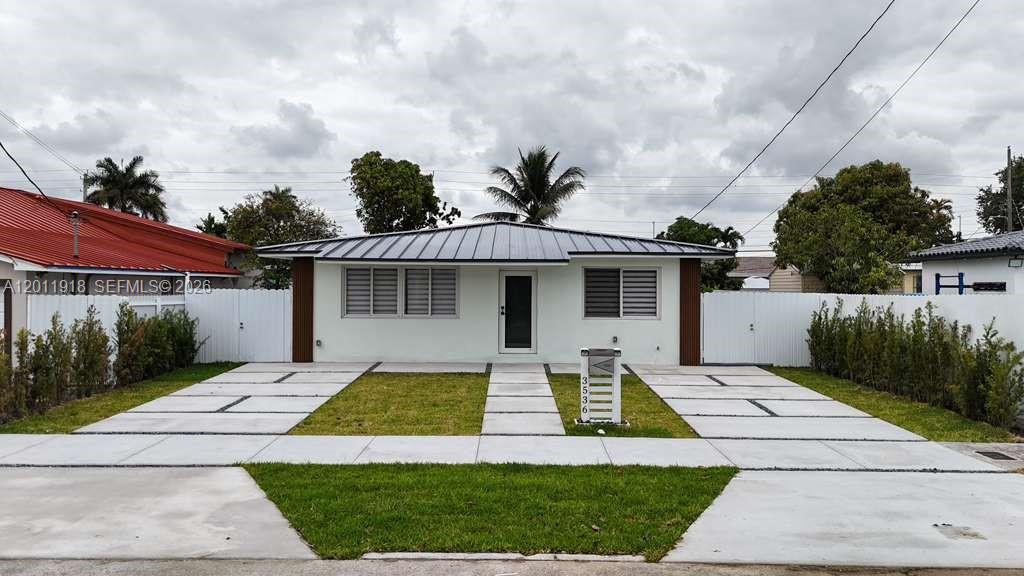 Welcome to this beautiful, recently renovated single-family home situated in the heart of Miami—a property that offers an exceptional investment opportunity or serves as the perfect home for first-time buyers. Recently renovated with impeccable taste and quality, this move-in-ready residence—awaiting its new owners—features a modern kitchen, a spacious living area, and elegant flooring. Furthermore, it boasts a brand-new roof, providing you with complete peace of mind for years to come. Enjoy comfortable living thanks to a new air conditioning system. With four bedrooms and three bathrooms, this home offers the ideal setting for hosting family and friends, highlighted by a terrace perfect for socializing alongside a charming backyard. The property is further distinguished by its new concrete driveway (constructed with all necessary permits) and a contemporary-style metal fence—features that enhance both its curb appeal and security. With a prime location just minutes from Miami International Airport and the new Soccer Stadium, as well as offering easy access to major highways, this home allows for effortless commuting to Brickell, Wynwood, Downtown Miami, the beaches, and Coral Gables—combining the convenience of urban living with the charm of a residential neighborhood. Don't let this unique opportunity slip away: acquire an extraordinary home in one of Miami's most coveted areas!