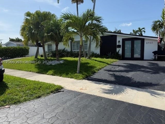 Comfortable, quiet oasis in desirable Whispering Pines section of Cutler Bay.  This home is ideal for those who love outdoor living.  This 4/2 features an outdoor covered patio area that is perfect for entertaining friends and family or enjoying cold beverages with a view to the pool.  This home has easy access to the Florida Turnpike and US1 from Caribbean Blvd, and is also a short drive to Black Point Marina and a short drive to Everglades National Park.
This home features a metal roof, updated PVC plumbing, sun-filled living spaces, and plenty of room to park your boat or fifth wheel.  This home offers the perfect blend of quiet comfort and functionality.  Whispering Pines is more than a neighborhood—it’s a community, hosting year-round events like golf cart parades, chili cook-offs, wing fests, and so much more.