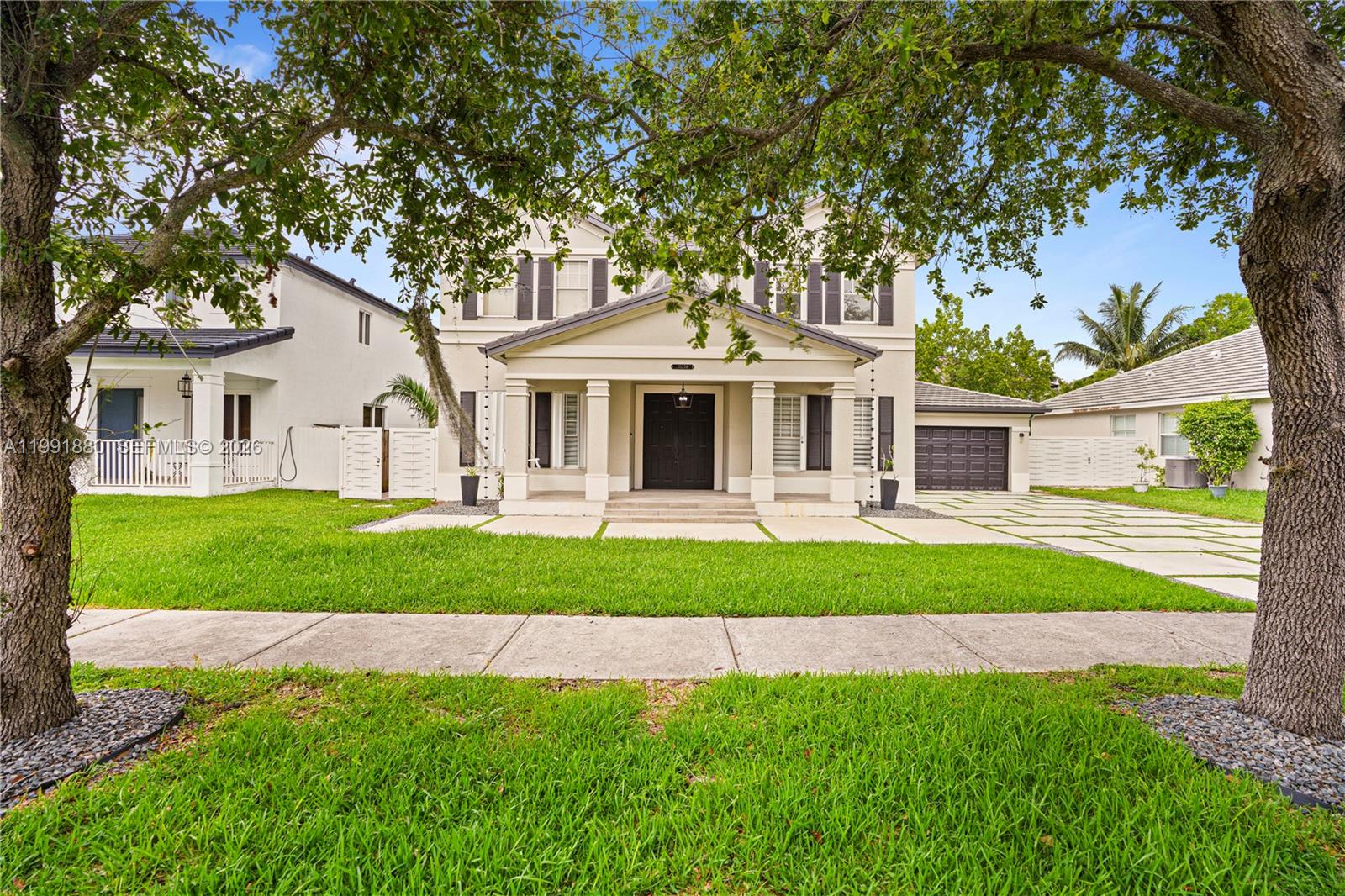 Gorgeous, updated 5-bedroom, 3-and-1/2-bath home. 2024 ROOF!! The remodeled kitchen features modern appliances, sleek countertops, and custom cabinetry, perfect for cooking and entertaining. NO HOA!!! Accordion shutters. Ample driveway area. The spacious layout features bright, modern upgrades throughout. The patio with a pergola is ideal for relaxation or gathering. Great location, minutes from major expressway, shopping malls. Easy to show.