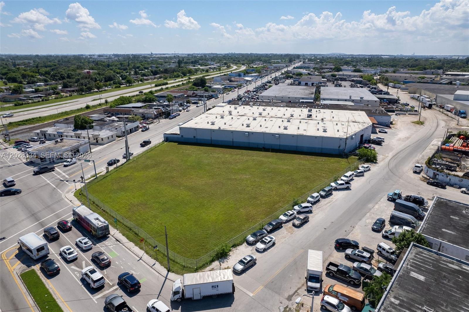 Rare 1.0-acre hard signalized corner development site at the gateway of the Opa-Locka Innovation District. Featuring 900+ LF of frontage across three sides, this 42,531 SF parcel is zoned B-2 with the Corridor Mixed Use Overlay supporting 146 residential units by-right at 3.0 FAR, expandable to eight stories through the affordability density incentive under the Live Local Act. Located within Miami-Dade's SMART Plan transit corridor - elevated Metrorail extension along NW 27th Ave. A prior approved Medical, Education, Office project is on file as an alternative development path. Phase I ESA reports no recognized environmental conditions. Qualified Census Tract eligible for enhanced LIHTC basis. Priced at $43.50 SF land.