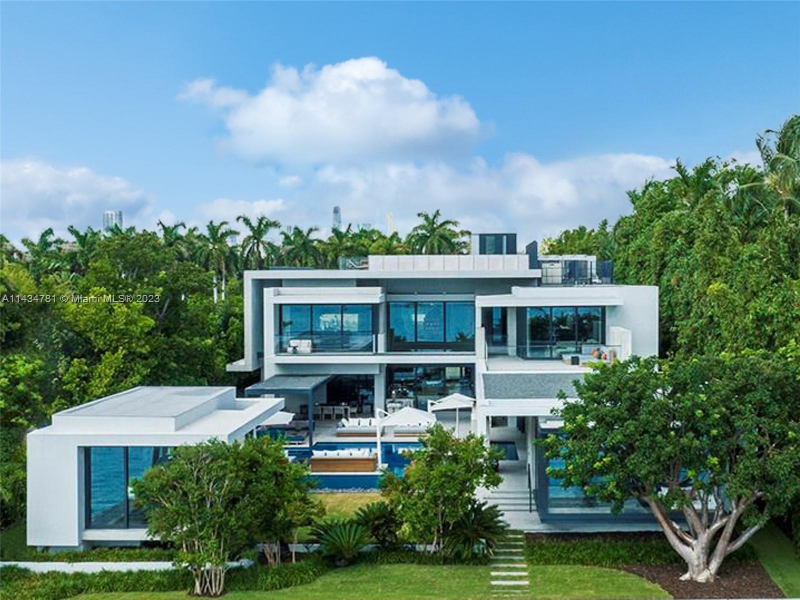 Step Inside with Me! Twenty Seven Star: A SAOTA Art of Work. A true unification of design, engineering, and grandeur, this Star Island dual-estate totals nearly 23,000 SF of meticulously crafted interiors and sophisticated style. Iconic in its introduction, reflective ponds and concrete privacy screens lead to a salon with 21ft ceilings. Acoustic paneled walls, a hosting bar & lounge with Olive Tree views, an industrial glam kitchen suited for a Michelin chef, and two media rooms complete the social areas. Retractable Peetz glass doors create a seamless transition to the amenities: resort pool, gym, sauna, bar, and garden. Step in time to a Walter De Garmo 1920's guest house reimagined to the highest standards. Star Island is Miami Beach’s most prestigious island enclave of 35 bay estates.