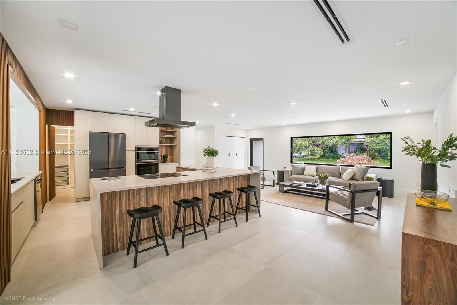 Presenting a breathtaking designer home featuring 5 Bedroom, 6.5 Bathrooms + Guest quarters + Garage on an Oversized lot.  A smart home with an outdoor kitchen/dinnig and amenities galore.