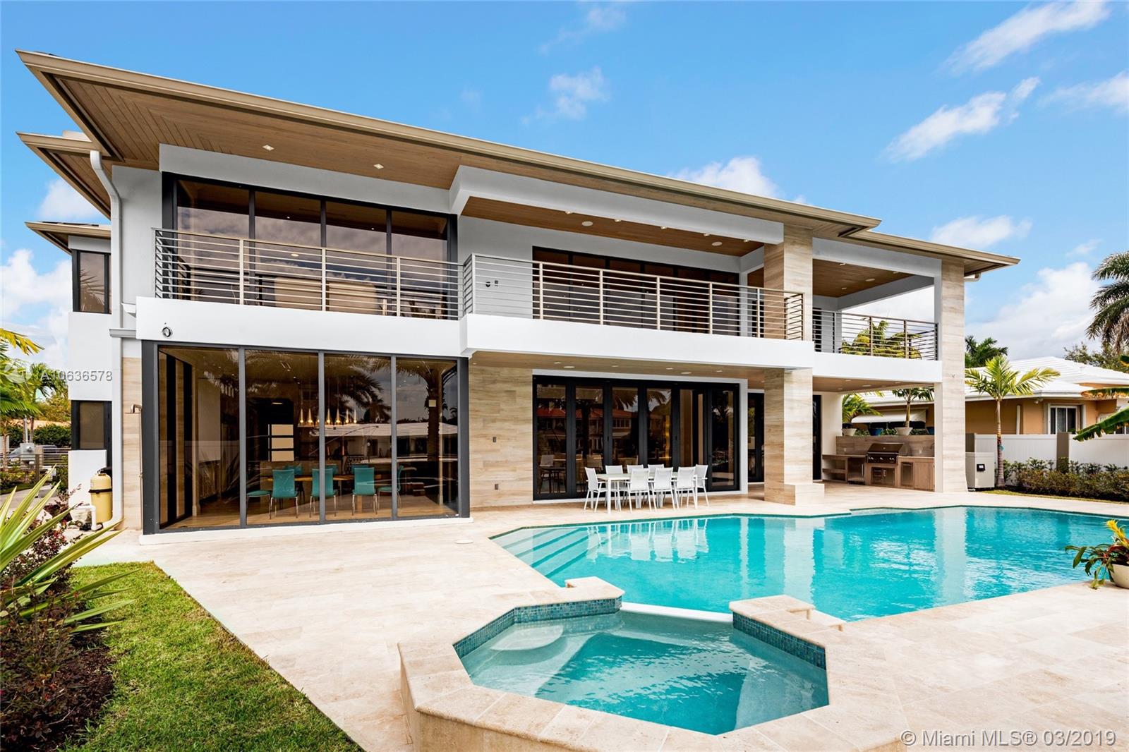 Inspiring brand new construction waterfront home in the desirable Coral Ridge neighborhood. The entrance greets you with 22 ft ceilings a modern flow-through design and a gallery bridge overhead. Featuring 5,600 sq ft of living space, 5 beds/5 baths, 2 laundry rooms, private elevator, 2 master bedrooms located on the first & second floor, Chef’s kitchen, butler pantry, 3 car garage with glass doors, outdoor summer kitchen, accordion impact glass sliding doors, roofed terraces, heated pool with spa, & one of the only homes in the area with natural gas. This home offers unparalleled finishes & impressive architecture ranging from custom champagne colored roof metal to real cypress soffits, made for any buyer looking for the perfect combination of high-end finishes with contemporary design.
