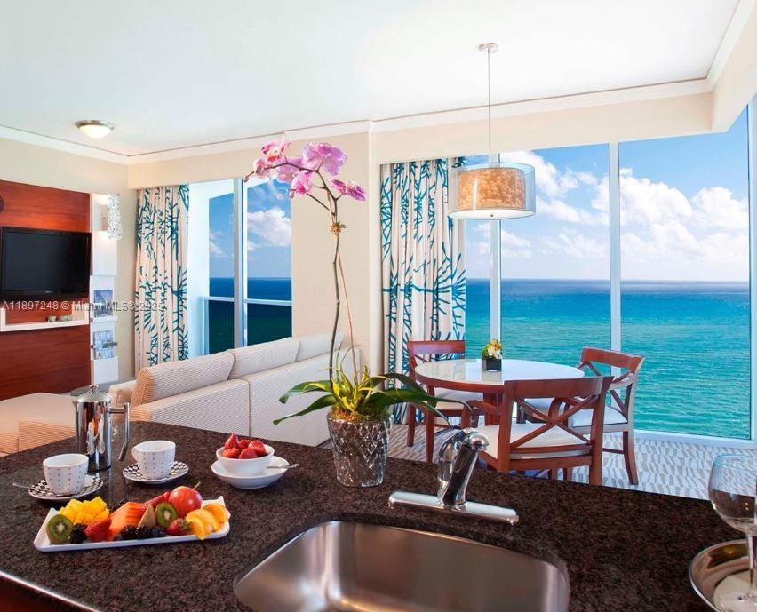 Large two bedroom suite, 1,477 square feet, DIRECT OCEAN FRONT!!! the unit can be separated in 2: Suite and a 2nd smallest area. Suite: Full kitchen, washer/dryer, KING bed in Master, living and dining area. 2nd area: 2 queen bedrooms, full bathroom, kitchenet. Best resort amenities with two pools, 4 restaurants, tennis courts, full service spa, fitness center, salon and so much more! Great investment to live while you are in town and rent it while you are away. Units can rent privately daily or by hotel program.