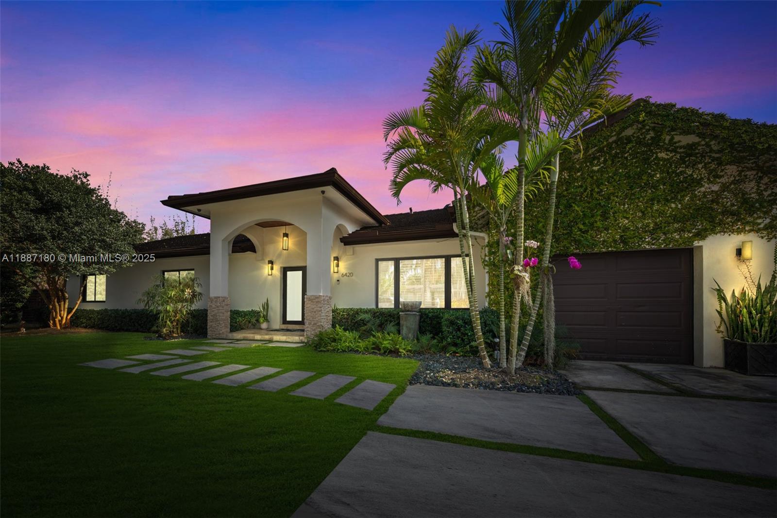 Experience luxury living at its finest in this exquisite South Miami home, perfectly situated on a private, tranquil street. This stunning residence boasts soaring ceilings, elegant high-hat lighting, and seamless surround sound throughout. The gourmet Ital Kraft kitchen features premium Thermador appliances, ideal for culinary enthusiasts. Indulge in the spacious primary suite with a custom walk-in closet and a spa-inspired bathroom retreat. Impact windows, plantation shutters, and a tankless gas water heater ensure comfort and peace of mind. Step outside to your backyard oasis — a covered patio, sleek saltwater heated pool, and lush artificial turf create the perfect setting for relaxation and entertaining.