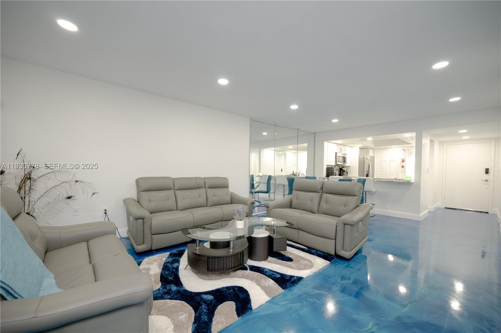 Spacious 2BR/2BA condo in North Miami Beach. Large living area. Remodeled kitchen with granite countertops, white cabinetry, decorative backsplash, stainless steel appliances, recessed lighting, and blue epoxy flooring. Updated bathrooms. Amenities include clubhouse, pool, and sauna. Convenient location near shopping centers, LA Fitness, Publix, Aventura Mall, and beaches. 55+ community. Building has passed the 40-year certification.