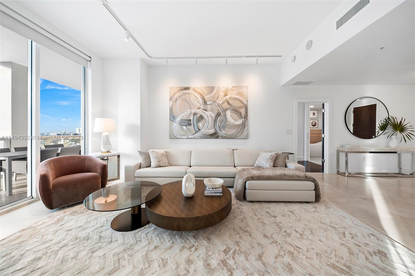 Striking high-floor with impressive southwest exposures from this brand-new, designer turnkey corner residence, ready for immediate occupancy. Experience amazing susets over the ever-changing Miami downtown skyline while parading cruise ships pass by Fisher Island, just below any of your 3 terraces, including an oversized double-wide, 10' deep balcony, exquisite for entertaining. Upgraded modern baths and a unique kitchen w/floor-to-ceiling glass walls and its own breakfast terrace.  The split floor plan features a private lobby, expansive formal living+dining, custom LED walk-in +huge storage room. Continuum is a 13 acre beachfront oasis w/amenities galore and attention to its residents second to none. Private restaurant+beach club, 3 har-tru tennis courts, 24K SF wellness center +3 pools