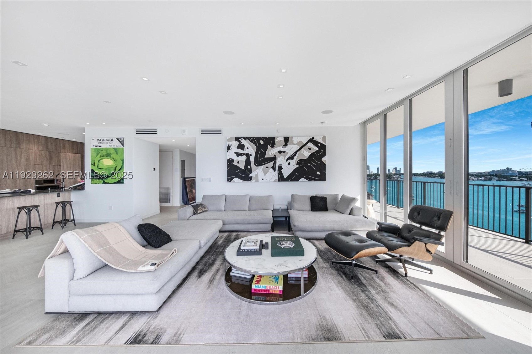 Stunning 2025-renovated corner residence in the iconic 1000 Venetian. This rare 04-line unit features a wrap-around balcony with 180° bay, sunrise & sunset views, plus newly upgraded hurricane-impact windows and sliders. High-end finishes throughout: automatic blinds, blackout
shades, Lutron lighting, ceiling speakers, art lighting, custom closets, TOTO Neorest toilets, Thermador appliances, wine fridge, large-format kitchen with soft-close & Blum push-to-open cabinetry, and LG large-format washer/dryer. Primary suite offers a spacious his-and-hers shower
and dual sinks. Prime location with easy access to Miami Beach, Edgewater, Brickell & Sunset Harbour.