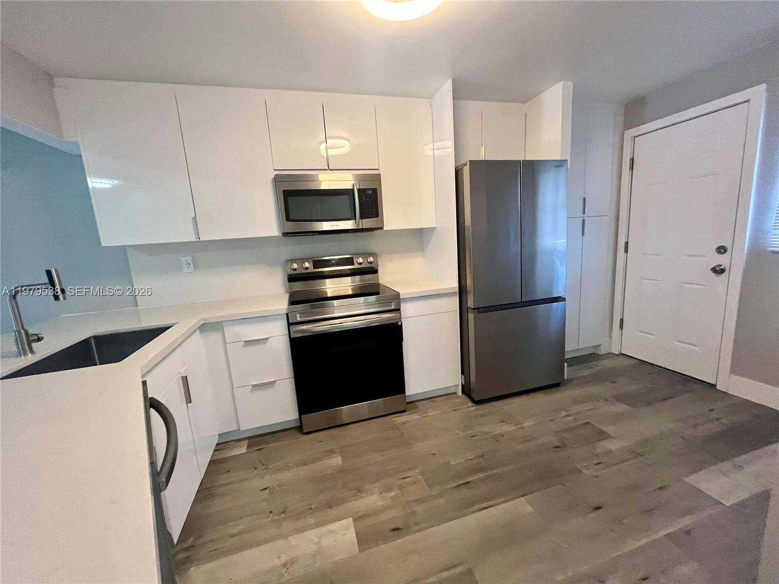 Move-in ready condo featuring a modern kitchen and brand-new flooring throughout. This beautifully  remodeled unit includes two large TVs in the sale, making it truly ready for immediate enjoyment. Enjoy a low-maintenance lifestyle with the largest assessment covered. The building offers excellent value with cable, water, and insurance included in the maintenance fees, and two registered parking, only one assigned. Conveniently located just minutes from the beach, major expressways, supermarkets, Aventura Mall, and a wide variety of specialty restaurants and entertainment options. Perfect for those seeking comfort, convenience, and a prime location. Do not wait for this community, prices will be going up soon. Plenty of storage space throughout the unit. An additional outdoor storage unit is included for added convenience. The property comes with one assigned parking space plus one open parking space. Laundry facilities are located on the same floor as the unit. The community offers four swimming pools, including one heated pool, two saunas and a large pergola to enjoy . It is a guard-gated community with 24-hour security, providing both comfort and peace of mind.The building has completed its 40/50-Year Certification. Leasing is permitted after one year of ownership, making it a great option for both homeowners and future investors.
