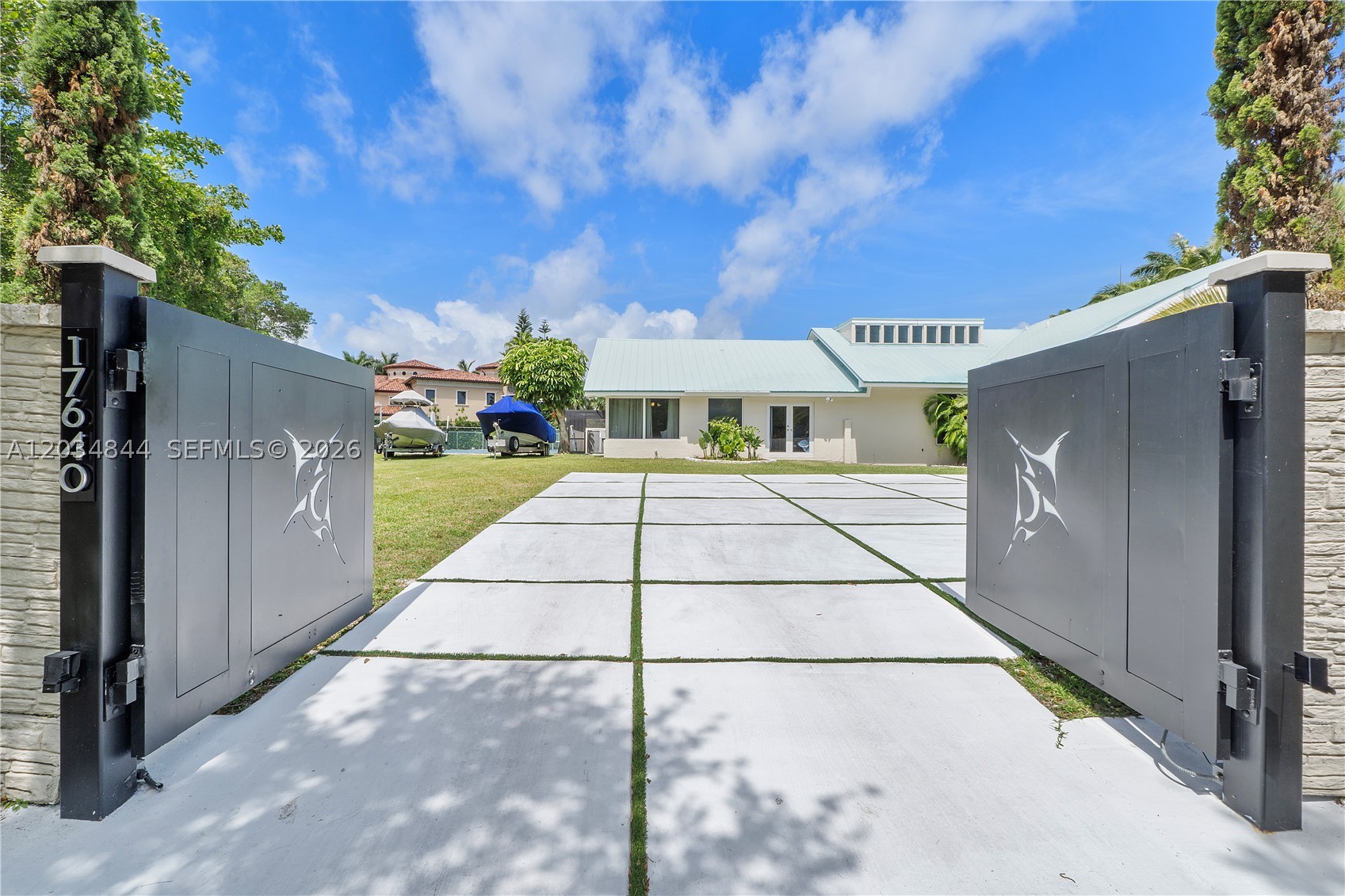 Priced below Bank Appraisal! The perfect entertaining home is looking for it's new owner! One of a kind gated on historic Old Cutler Road in Palmetto Bay. Builders Acre, five bedrooms & three & a half bath Luxury Home. Amenities include you're own private pickle ball/tennis court, two fire pits, heated & cooled pool/spa, room for boat/RV parking, full outdoor kitchen, impact windows & doors, full indoor bar with icemaker, renovated bathrooms, eat-in chef's kitchen including custom cabinetry, propane gas cooktop, stainless appliances, breakfast nook and pantry. Actual living square footage measures 4018 much larger than tax roll. Formal living and dining room, fireplace and giant media room for game day! Recent bank appraisal in MLS attachments. Four photos have been virtually staged. Show less