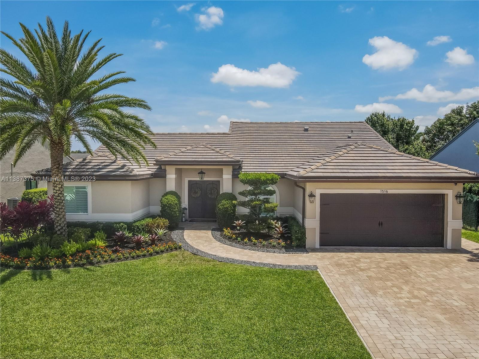 Marvelously Stylish and Upgraded Home with Heated Swimming Pool! Situated in a coveted community only ½ mile from excellent schools, this 4BR/3BA, 2,300+sqft property dazzles with lush tropical greenery and a custom paver driveway. Only updated by licensed contractors with appropriate permits, the interior features an open concept floorplan, plantation shutters, automatic blinds, and a gourmet kitchen with highly-rated GE Monogram appliances. Gather outdoors in the fenced-in and fully-turfed backyard, which has a heated PebbleTec pool with LED lights (controlled by app) and a covered lanai. Find tranquility in the primary bedroom with a California closet and chic en suite. Other features: insulated 2-car garage w/built-ins, newer roof (2018), near shops, and more! Call now for your tour!