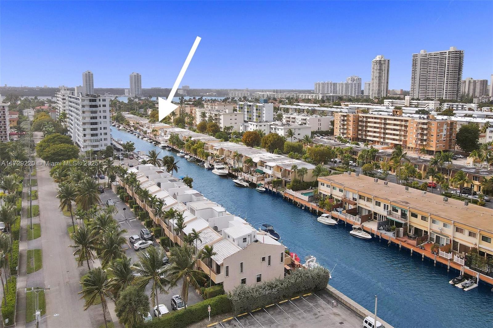 Gorgeous WATERFRONT townhome in Eastern Shores! Some of the special features are : fabulous porcelain tile, top of the line modern kitchen and new appliances, stunning bathrooms with double sinks, jacuzzi tub and separate shower. Impact windows through out. Jacuzzi on the patio . Beautiful view of waterway and canal - dock your small boat or jet ski. Ocean access! No fixed bridges to Ocean. Eastern Shores is in a great location with police manned guard gate and walking distance to supermarket, restaurants, shopping, Oleta State River Park and Beach.