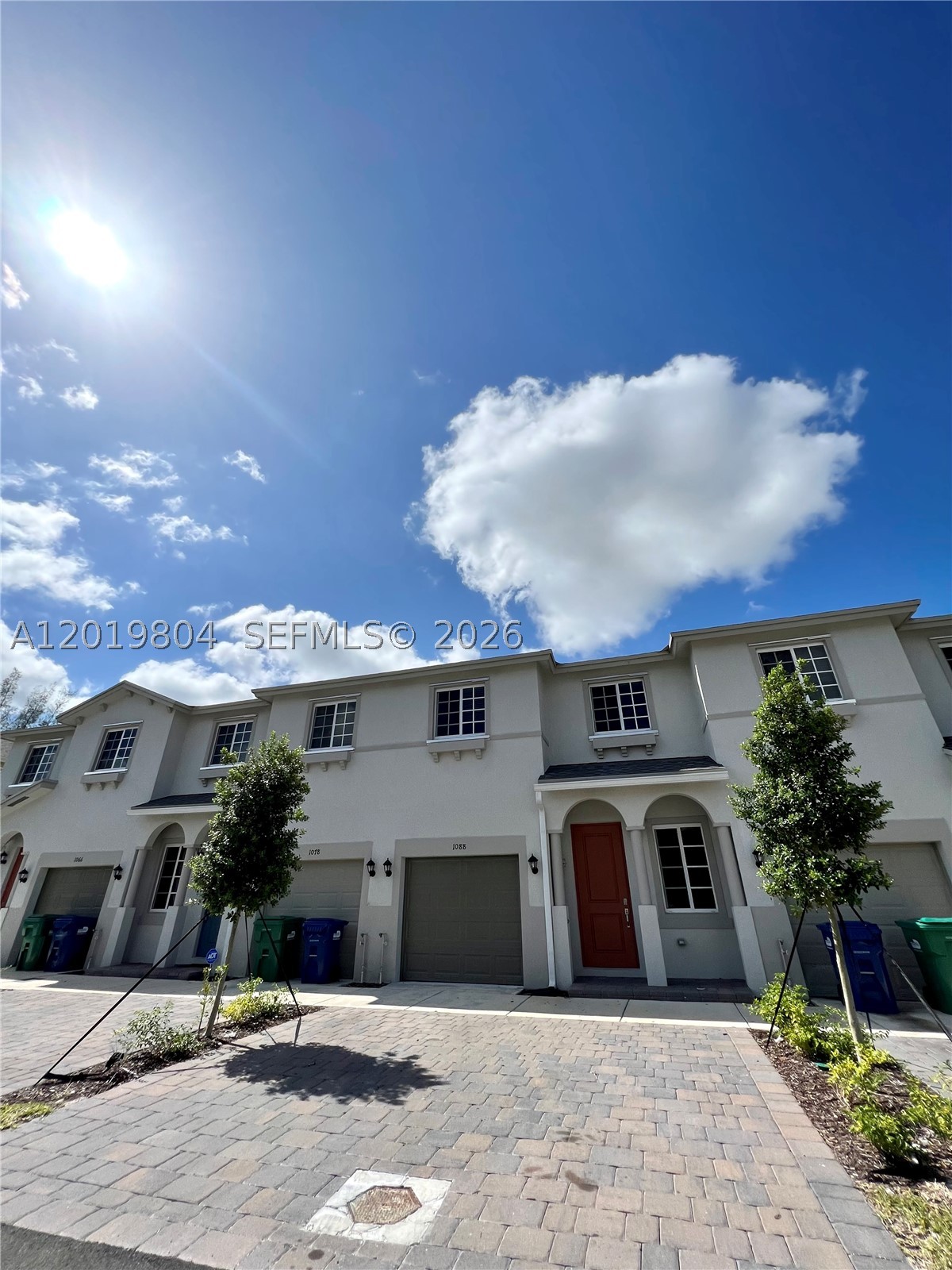 Beautiful and spacious 4-bedroom, 3-bathroom townhome located in the heart of Miami Gardens. This well-maintained residence features tile flooring on the first floor and carpet on the second floor for added comfort. Equipped with Smart Home connectivity, it offers modern convenience and functionality. Enjoy a generous living and dining area, along with a functional kitchen that opens to a cozy family room—perfect for everyday living and entertaining. Step outside to a large, fenced patio ideal for outdoor gatherings. Ceiling fans in all bedrooms enhance energy efficiency, and the property includes a washer and dryer. The home also offers a one-car garage plus two additional parking spaces in the driveway. Ideally situated just minutes from major highways, including only a 4-minute drive to the Florida Turnpike, and close to schools, supermarkets, and shopping centers. Located in Walden Place, a newer community offering a family-friendly environment with amenities such as a kids playground, clubhouse, walkways, and green spaces. A perfect opportunity for comfortable and convenient living in a growing area.