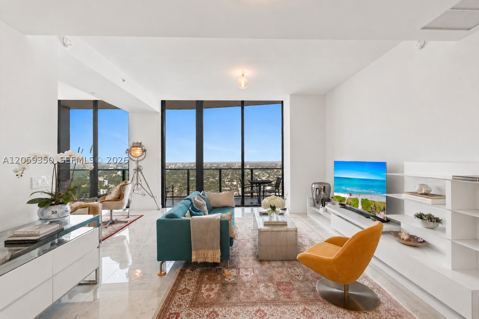 Perched atop one of Brickell’s most exclusive addresses, Flatiron, PH6106 offers a rare opportunity to own a residence of extraordinary scale, volume, and panoramic views. One of the original bedrooms has been thoughtfully incorporated into the living area, creating an expansive great room with soaring ceilings, floor-to-ceiling glass, and an exceptional sense of light and openness.

The residence features top-of-the-line finishes throughout, two full bathrooms, a powder room, and a versatile den ideal as a home office or guest suite. From its remarkable bird’s-eye vantage point, sweeping skyline, bay, and city views stretch for miles, transitioning seamlessly from brilliant sunrises to Miami’s iconic evening skyline.

Residents enjoy world-class amenities, including a rooftop pool and spa on the 64th floor, an additional lap pool, state-of-the-art fitness center, yoga studio, steam rooms, sauna, movie theater, social lounge, wine room and cellar, children’s playroom, library, concierge, valet, and a 24-hour attended lobby.

Ideally positioned in the heart of Brickell, Flatiron places Miami’s premier dining, shopping, and entertainment just outside your door. Sexy Fish, one of the city’s most celebrated restaurants, occupies the ground floor, while Mary Brickell Village, Brickell City Centre, world-class cafés, fitness studios, grocery stores, the Metromover, and Metrorail are all within a short walk, offering one of Miami’s most vibrant and walkable urban lifestyles.