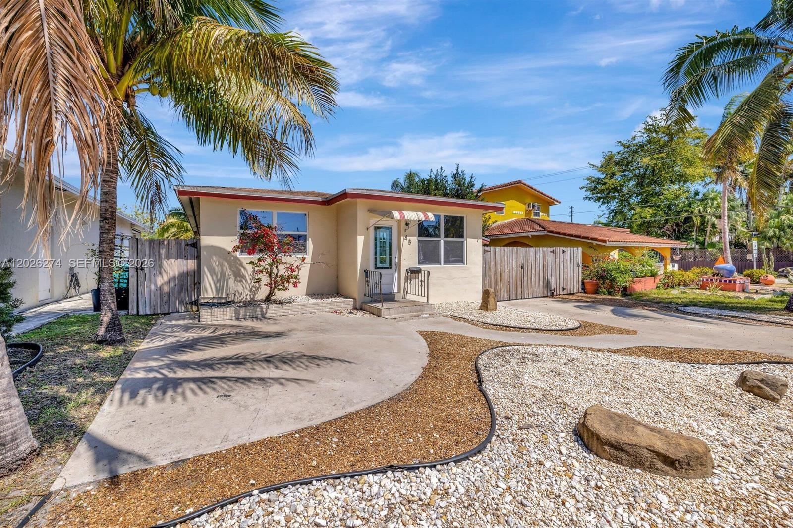 Welcome to this beautifully maintained 3 bed 2 -bath home in the East Dania Beach area! Front House is a 2 bed 1 bath with laundry, Attached in back is a one bedroom and one bath with a private entrance currently rented  monthly. 2015 roof and impact windows. BEST LOCATION & NO HOA Just a short drive or a scenic bike ride to the beach, Very close to downtown hollywood many shopping areas and restaurants. Close to Olsen middle school and South broward high. Unit has open floor plan with abundant natural light, impact windows for safety and energy efficiency. WOOD FLOOR living room and bedrooms and TILE in kitchen. Granite counter tops in kitchen. The large fenced yard provides ample space for outdoor entertaining.  A standout feature of this property is its legal duplex status -- making it ideal for generating rental income or hosting guests.