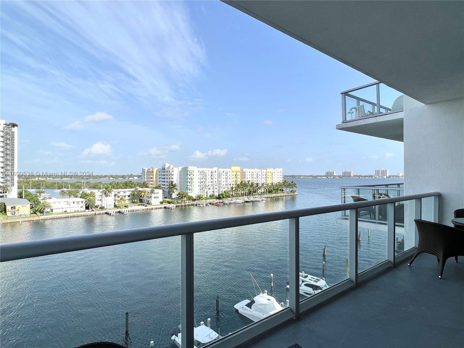 Breathtaking waterfront residence featuring captivating views from sunrise to sunset! This large 2 bed, 3 bath residence has a versatile den suitable as a small bedroom or office. Over 1400 sq ft with lofty 10+ ft ceilings. Residence features an open flow- through layout, both bedrooms are ensuite and have their own balconies. Enjoy top-notch amenities including a waterfront pool, jacuzzi, fitness center, tennis and basketball courts, community room, 24-hour security, and concierge services. Includes 2 parking spaces. Nestled in the highly sought after Harbor Island in the heart of North Bay Village.