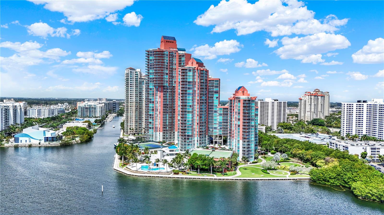 Beautiful Tower Suite residence featuring 2 Bedrooms and 2.5 Bathrooms in the prestigious Hidden Bay Condo in Aventura. Rarely available high-floor corner unit offering breathtaking views of the city, Intracoastal, and ocean through floor-to-ceiling impact windows. This modern split floor plan features spacious bedrooms with walk-in closets and access to 3 private terraces perfect for enjoying sunrise and sunset views.

Elegant interiors showcase wood flooring, abundant natural light, and an open-concept living and dining area ideal for entertaining. The primary suite offers a spa-inspired bathroom with dual vanities, soaking tub, and glass-enclosed shower.

Enjoy resort-style 5-star amenities including clubhouse, spa, state-of-the-art fitness center, tennis courts, 2 pools, BBQ area, private marina, concierge, valet parking, and beautifully landscaped grounds. Prime Aventura location just minutes from Aventura Mall, fine dining, parks, and beaches. Luxury living at its finest!