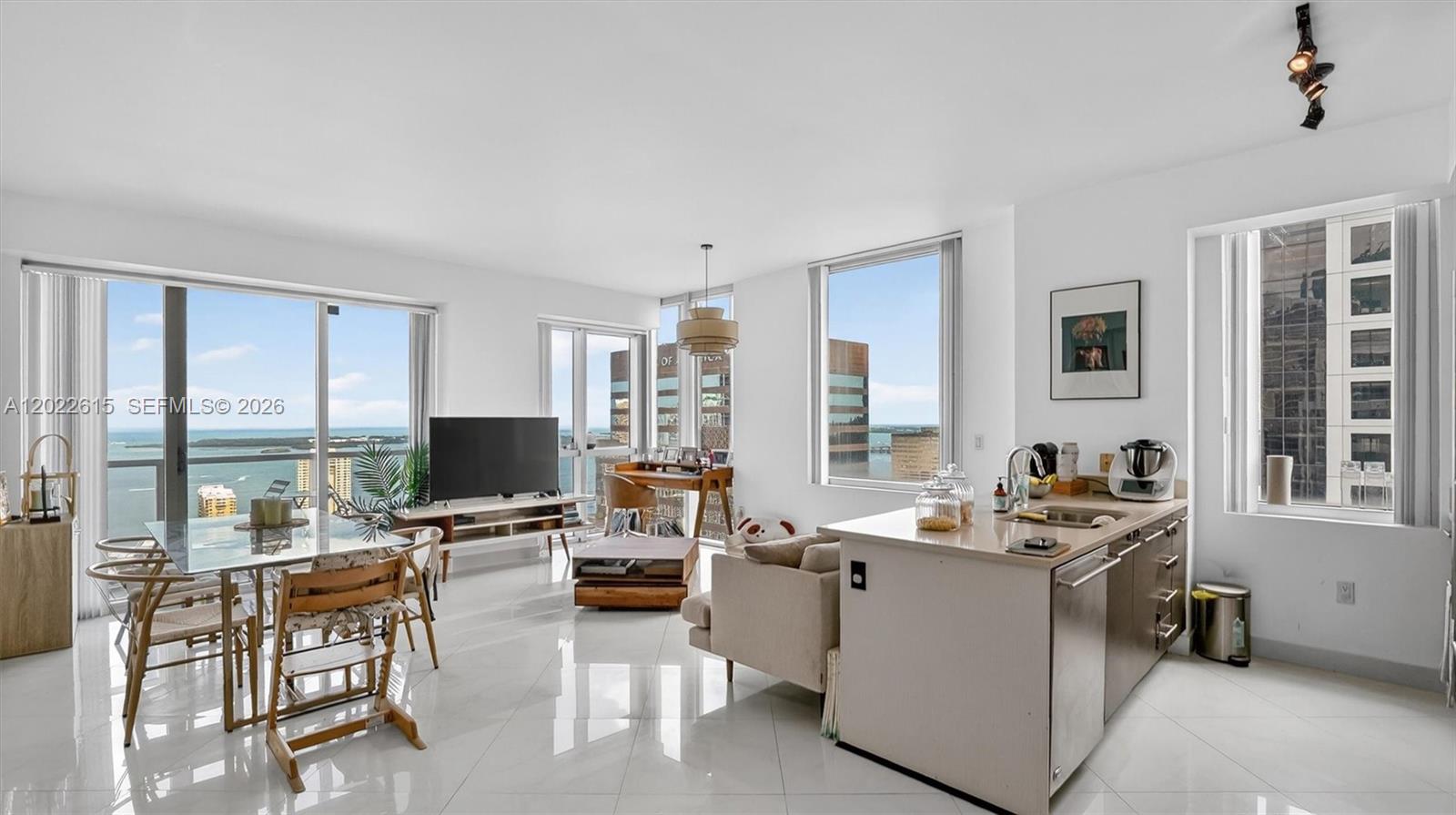 WATER VIEWS AT BRICKELL AVENUE! A rare find on Miami's most desirable street! The absolute centerpiece of this massive 2BR/2BA corner residence is its jaw-dropping, unobstructed panoramic water views of Biscayne Bay—undeniably the best and most breathtaking feature of the entire unit. Perched 41 floors up, this highly coveted Lower Penthouse at the prestigious 500 Brickell Avenue boasts soaring 11-foot ceilings and wrap-around floor-to-ceiling impact windows that put the sparkling bay and glittering skyline on full display.

This expansive, extra-large split floor plan offers maximum space and privacy. The sophisticated open kitchen features premium Italian cabinetry, quartz countertops, and top-tier appliances. Retreat to the oversized primary suite, complete with luxury custom walk-in closets and an elegant en-suite bath.

Designed by Arquitectonica, 500 Brickell offers premium resort amenities: a spectacular 42nd-floor rooftop heated pool with 360-degree views, an 11th-floor pool deck with daybeds, high-tech fitness center, luxury spa with sauna/steam, private theater, wine cellar, and 24-hour concierge, security, and valet.

Directly on premier Brickell Avenue, you enjoy an elite lifestyle steps from Brickell City Centre, world-class dining, and the Metromover. A rare corner lower penthouse with the ultimate water views! Easy to show—schedule today!