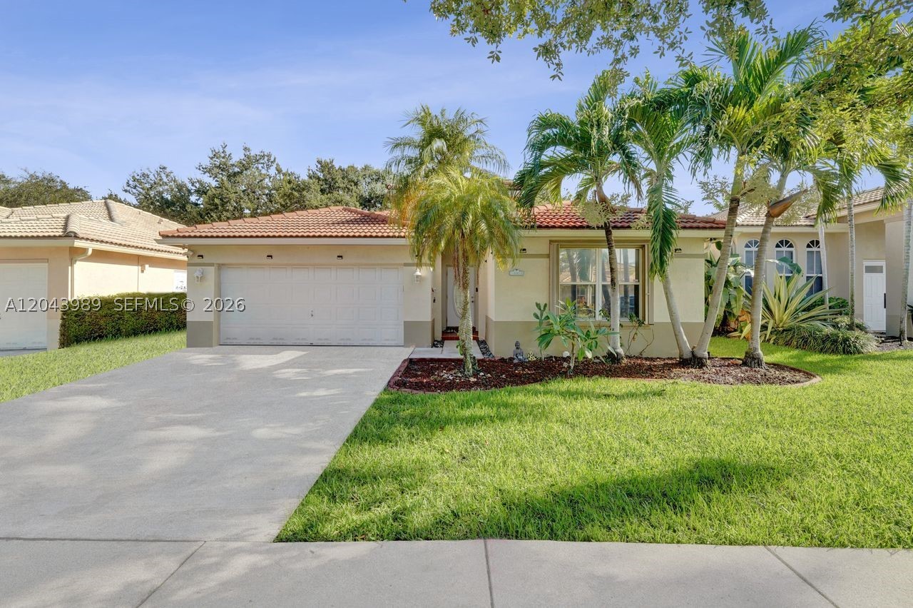 This is a gorgeous one-story home in Shenandoah's guard gated community of Poinciana Parc. Home is remodeled with 4 bedrooms and 2 1/2 bathrooms. Modern kitchen with quartz countertops, stainless steel appliances and wood cabinets. Beautiful porcelain tile flooring throughout. All bathrooms are completely remodeled incl. master bathroom which is spectacular. Large bedrooms and living areas. Backyard is very nice and private with lush landscaping. Excellent location with easy access to major roadways, Fort Lauderdale airport and restaurants.
