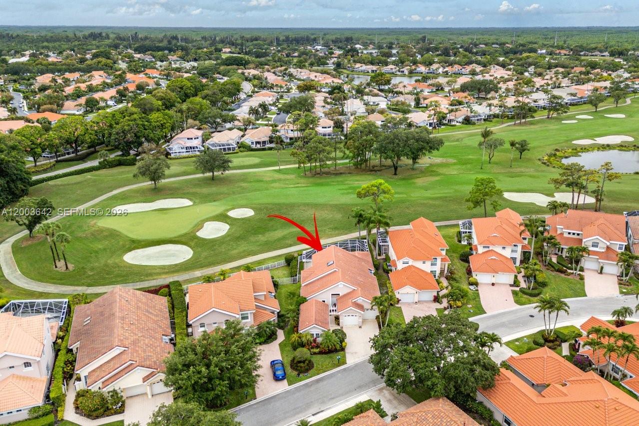 13th hole of the Champion golf course right in your backyard!  This home has it all with 4 Bedrooms, 4 bathrooms, 2-car garage.  Guest house can be used as office or guest bedroom with full bathroom.  Sun lit living space and kitchen with lots of windows and volume ceilings. Laundry room with sink, coat closet, large primary bedroom with sliders to your private pool.  The Cove at Eagleton is an exclusive double gated community, surrounded by golf course, waterways and is protected 24 hours by manned security gate.  Stress-free living as community power washes exterior, paints exterior, maintains landscaping.  Front lawns in process of being redone.  Close to I-95 and Turnpike - easy commute to Downtown WPB and airport.  Two pets (dog or cat).