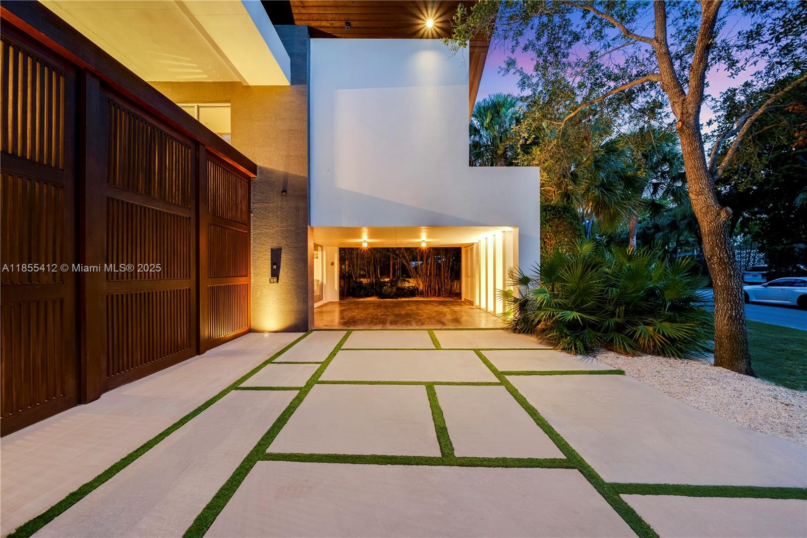 Key Biscayne – Architectural Masterpiece
On a secluded 9,633 sq.ft. lot near Harbor Drive, this 6,800 sq.ft. residence by Village Architects (Deborah de León) blends modern elegance with tropical serenity. A dramatic double wood door opens to a lap pool reminiscent of Amanpuri, framed by 2,000 sq.ft. of covered entertainment areas.
Inside, a glass-walled foyer, soaring ceilings, and a sculptural staircase set the tone. Formal dining, reception, and a chef’s kitchen flow seamlessly for refined living. The master suite offers vaulted ceilings, walk-in closets, a spa bath, and an adjacent office, complemented by three additional en-suite bedrooms.
Rare offering of design,privacy & resort-style living in the heart of Key Biscayne.Please view unbranded matterport  t, floor plans &  video.