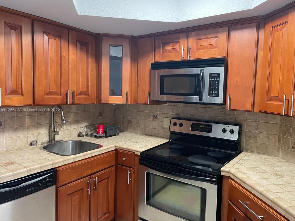 Spacious 2 beds / 2 baths apartment  located in Las Vistas at Doral. Freshly painted!, Stainless Steel appliances, porcelain, tile floors, washer and dryer inside the unit. Open balcony w/ extra storage and hurricane accordion shutters on windows and sliding glass door. Two assigned spaces and plenty of guest parking available. Additional amenities in the community includes: pool, tennis courts, exercise room, management on-site, and security patrol. Great location in Doral, conveniently located near Palmetto, Downtown Doral and City Place. Just minutes away from great schools, shopping centers and restaurants.